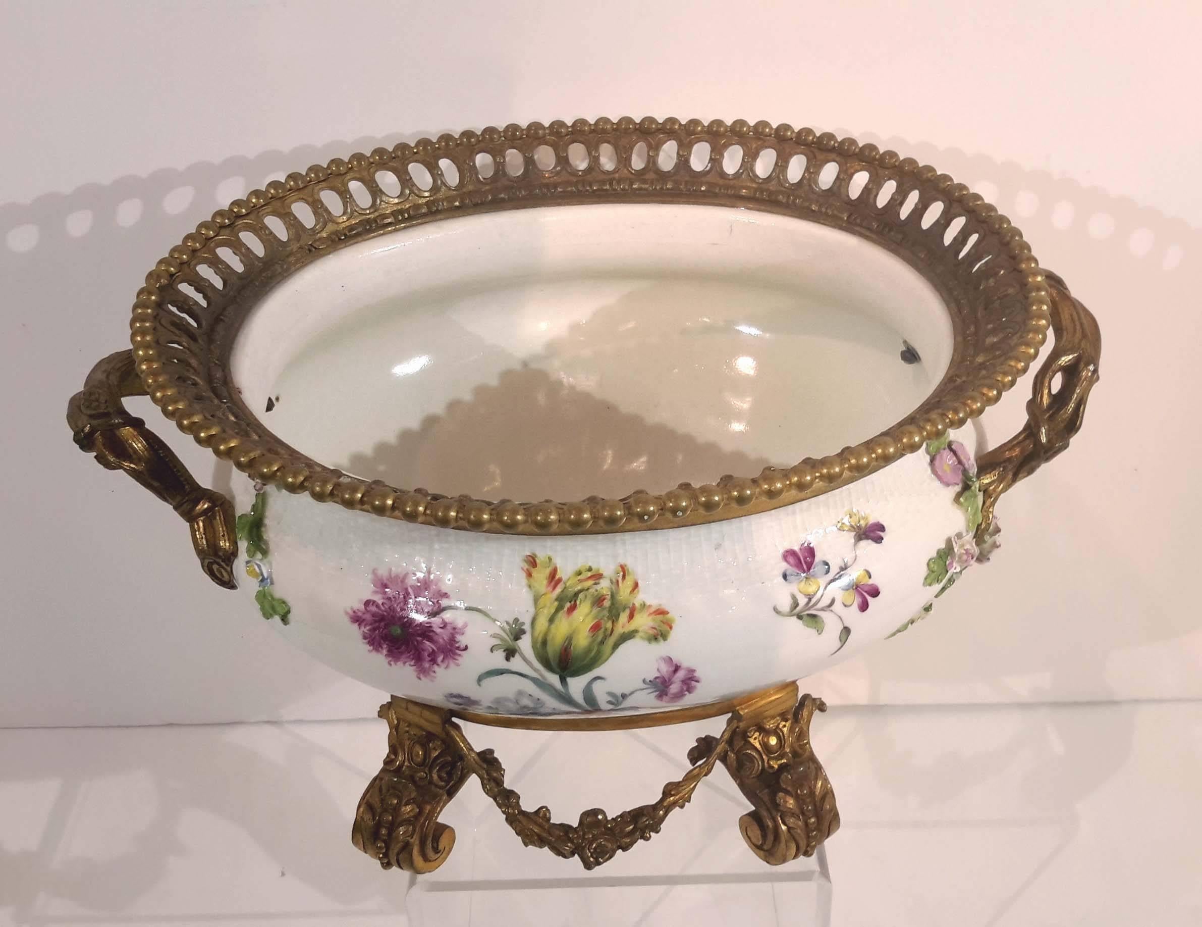 Great hand-painted details Meissen porcelain tureen later mounted in 19th century with gilt bronze mounts.

Early in the 18th century, Augustus the Strong, elector of Saxony, arrested alchemist Johann Friedrich Bottger and imprisoned him in the
