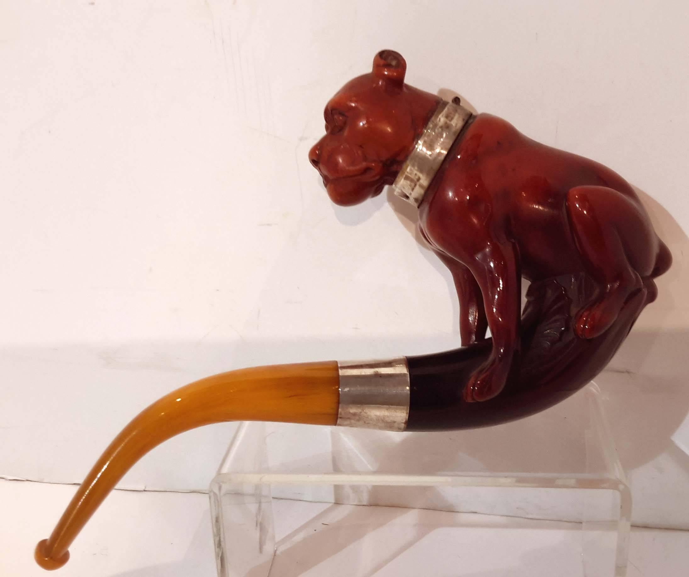 Mounted with sterling silver. Stamped with makers mark. The mouth piece probably amber or bakelite. Very good quality with lovely age patina.
           