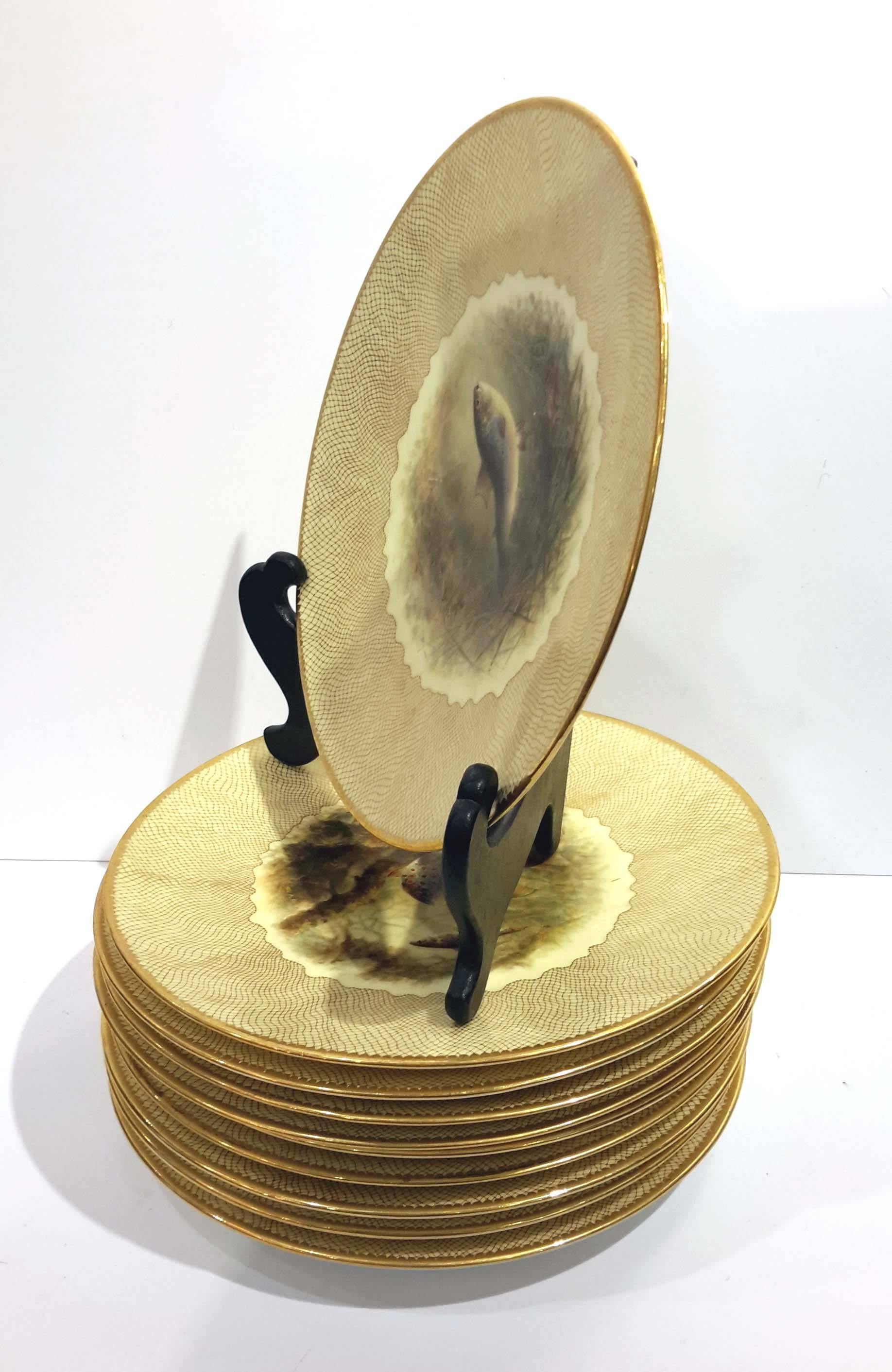 Retailed by: Higging & Setter, New York, circa 1890. Each plate is beautifully gilded with net decoration and hand painted with a different kind of fish. They are all signed in front by the artist D. Berbeck. In the back, name of the fish is hand