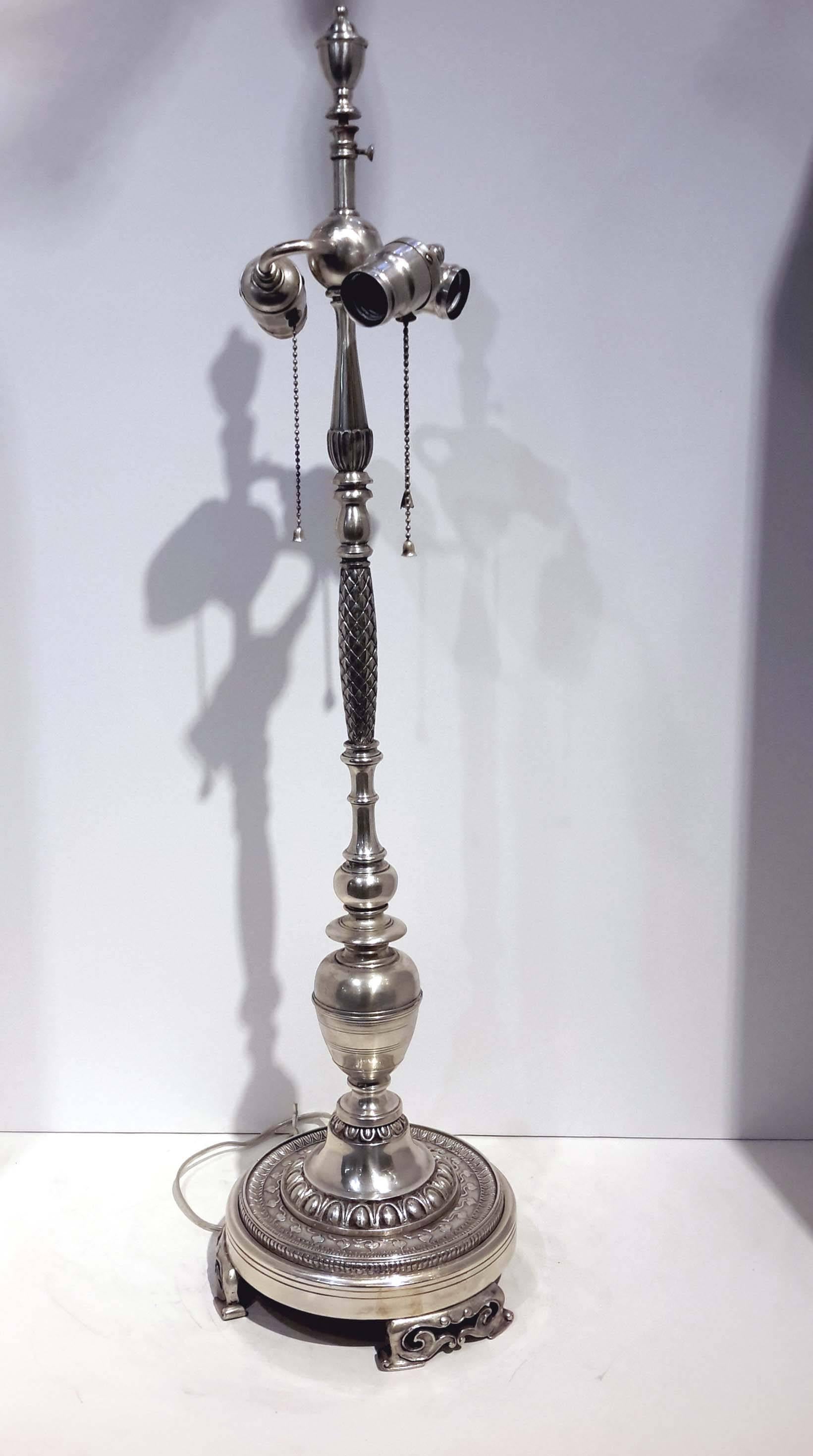 This lamp has been re-silvered and re-wired. It is not stamped with Caldwell Signature. New York.
Its of a great quality cast bronze and silver plated.