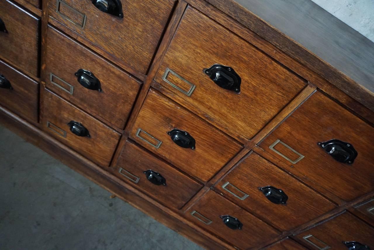 Industrial Vintage French Oak Apothecary Bank of Drawers, 1930s