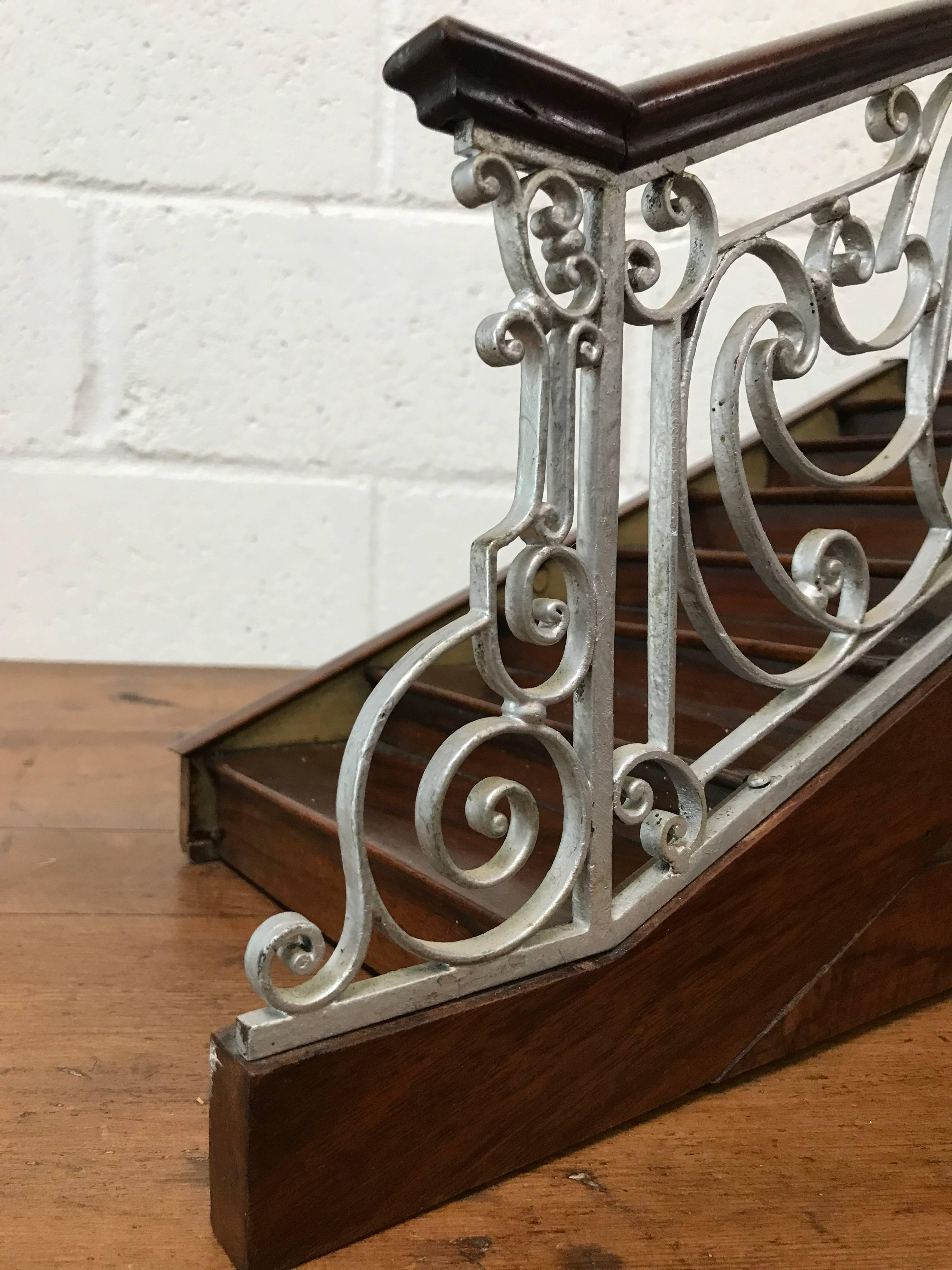 A fantastic original stair case model from a French railing shop to advertise their quality of work. Made from mahogany and polychrome marble look paint and railings from cast iron. The brass plaque is not original and has been added at a later date