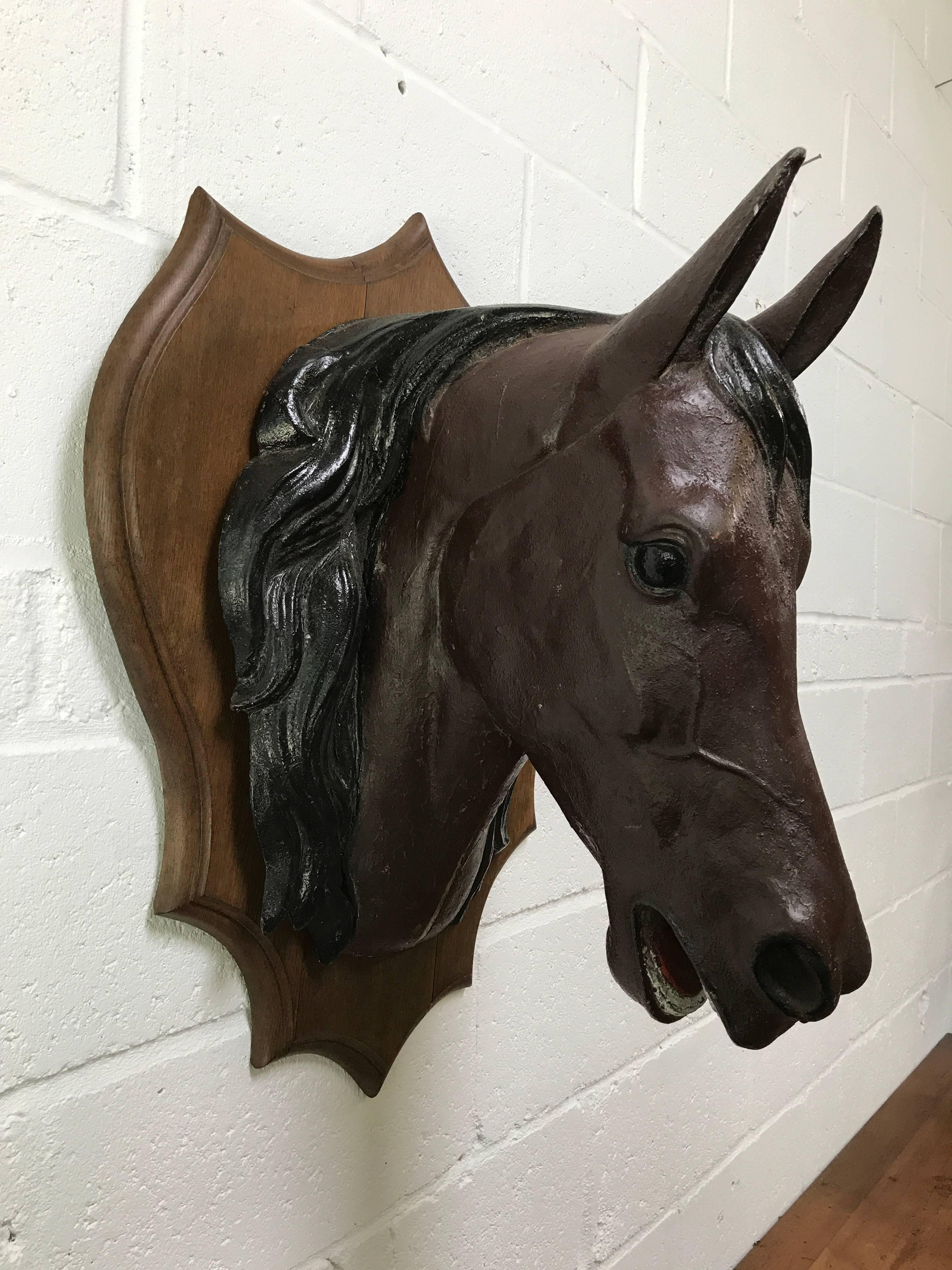A fantastic original circa 19th century zinc horses head from a butchers shop in France. Made from very thick zinc with original paint mounted on an oak shield.
 