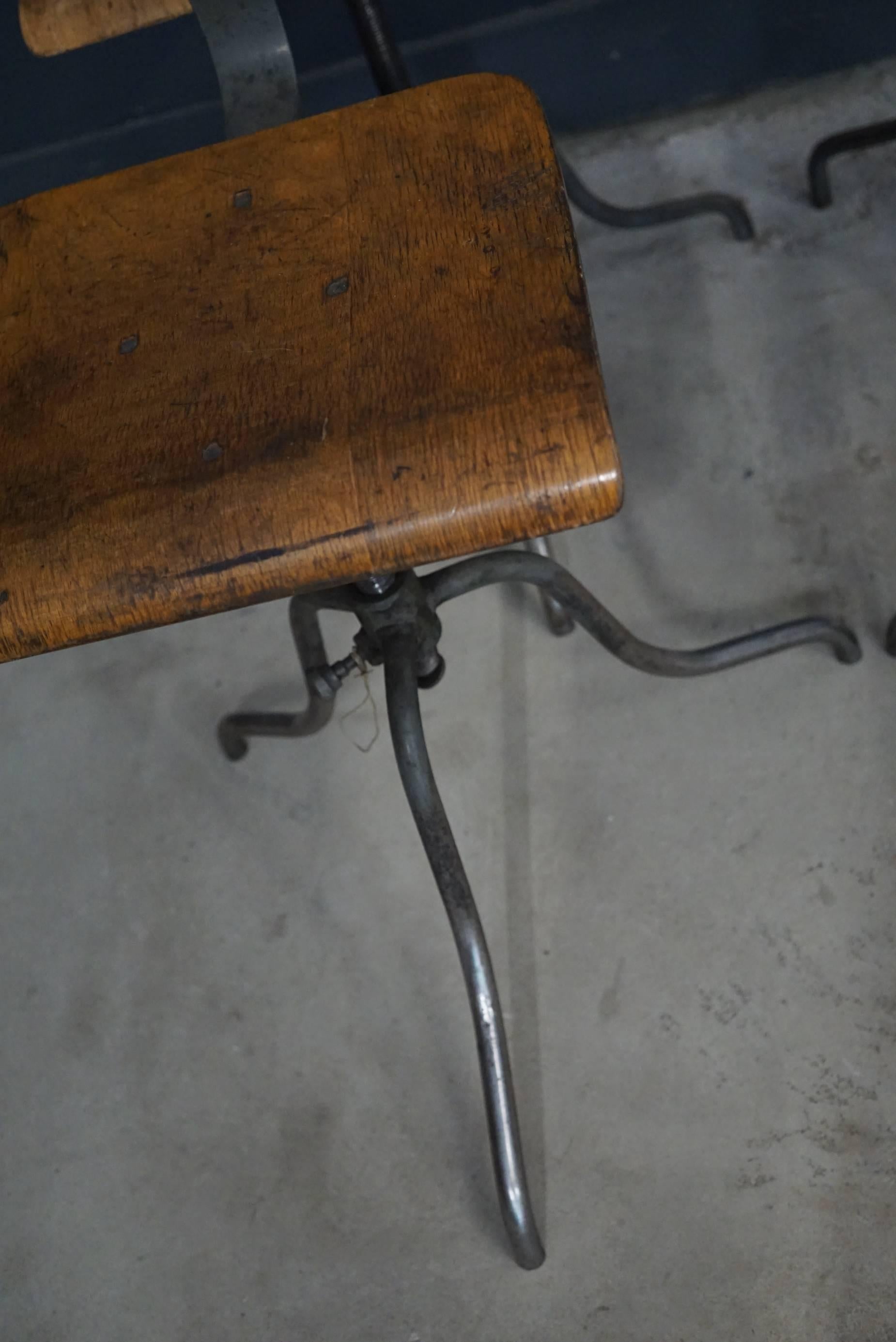 This set of four Industrial chairs were designed and made in East Germany, circa 1950s. They feature a metal frame with wooden seat and backrest.