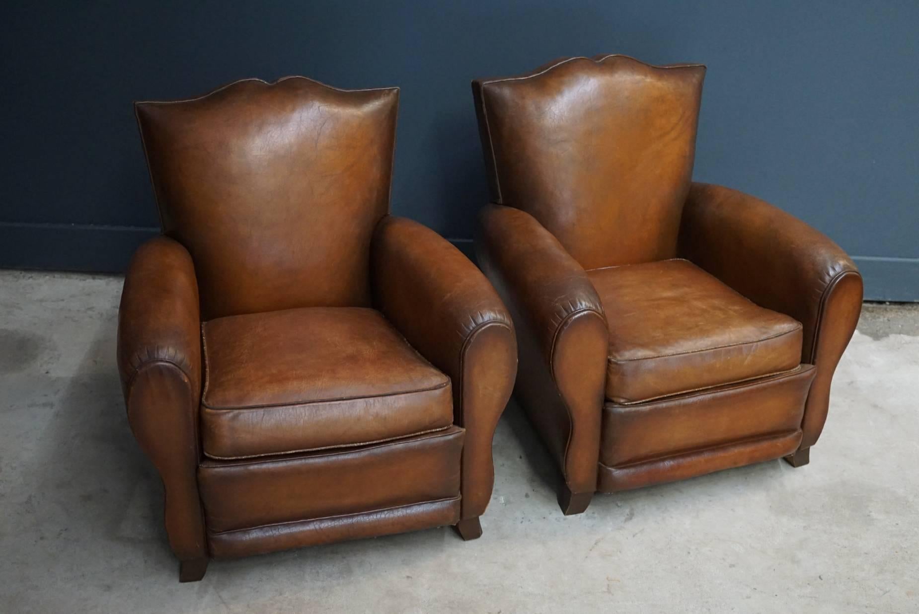 Industrial Pair of French Cognac Moustache Back Leather Club Chairs, 1940s
