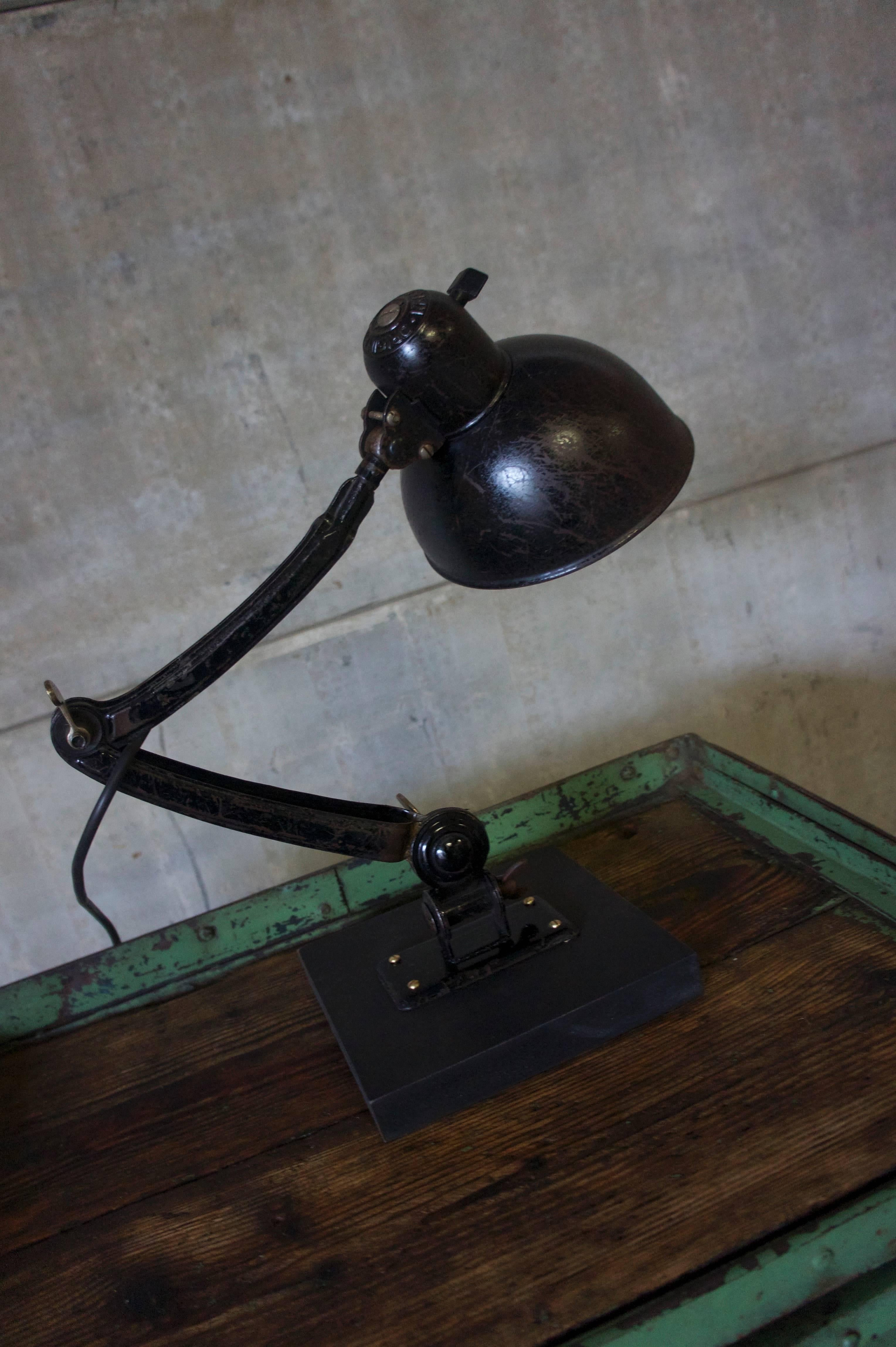 This desk lamp was manufactured by Kaiser Idell during the 1940s model 6716. It is made from metal, with a black lampshade. The lamp has been recently been restored and rewired, and is in a good vintage condition.