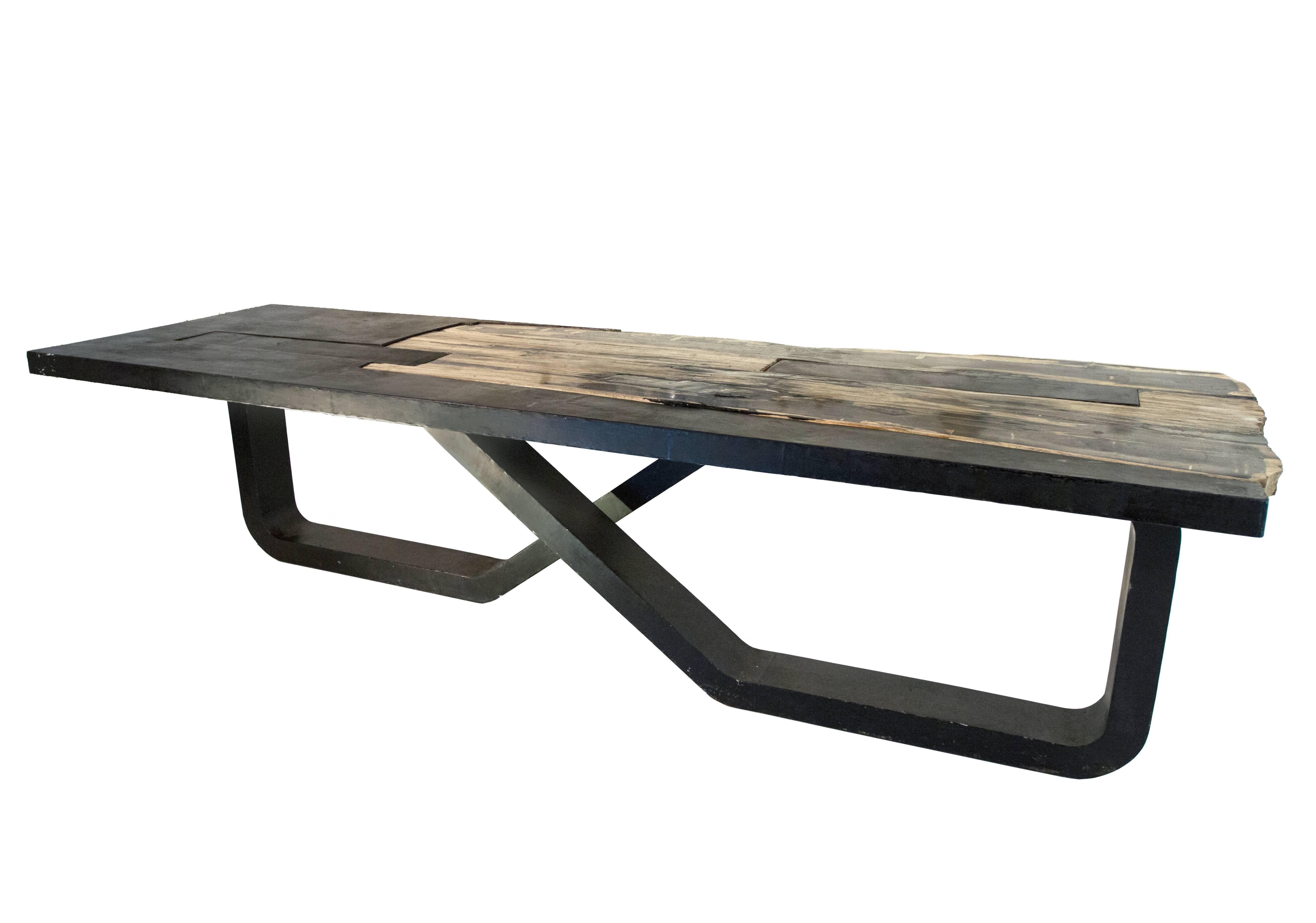 This unique infinity table is made to order and one of a kind. The weight of the slab keeps the table connected as the two infinity legs are not connected to one another. This four piece table is a statement piece for any interior.

With a steel