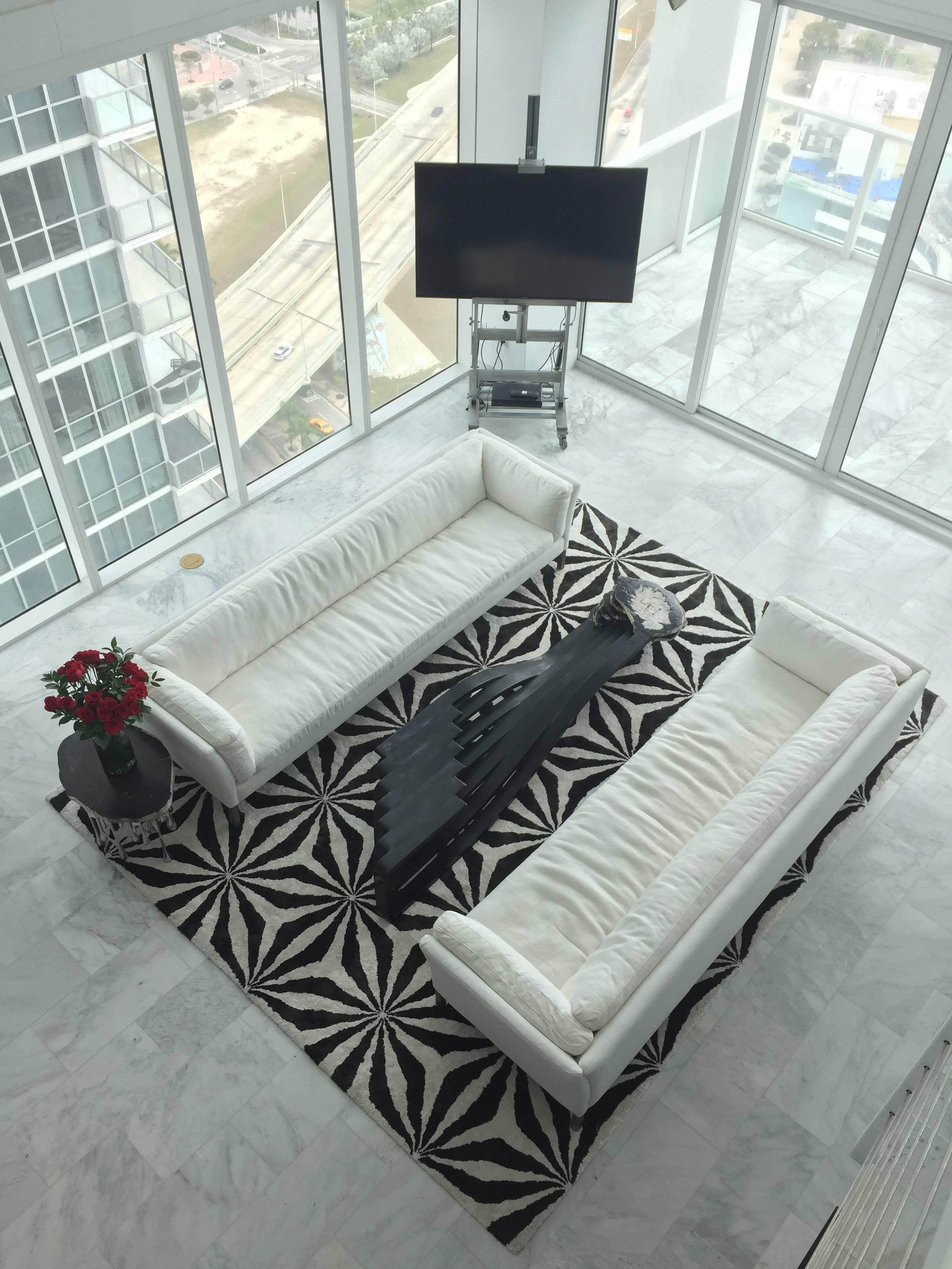 Inspired by principles of sacred geometry, this mind altering silk tufted rug is an elegant statement piece for any home.  The intricate interlocking geometries evoke a deep sense of timeless elegance.  The bold geometric graphic instantly adds