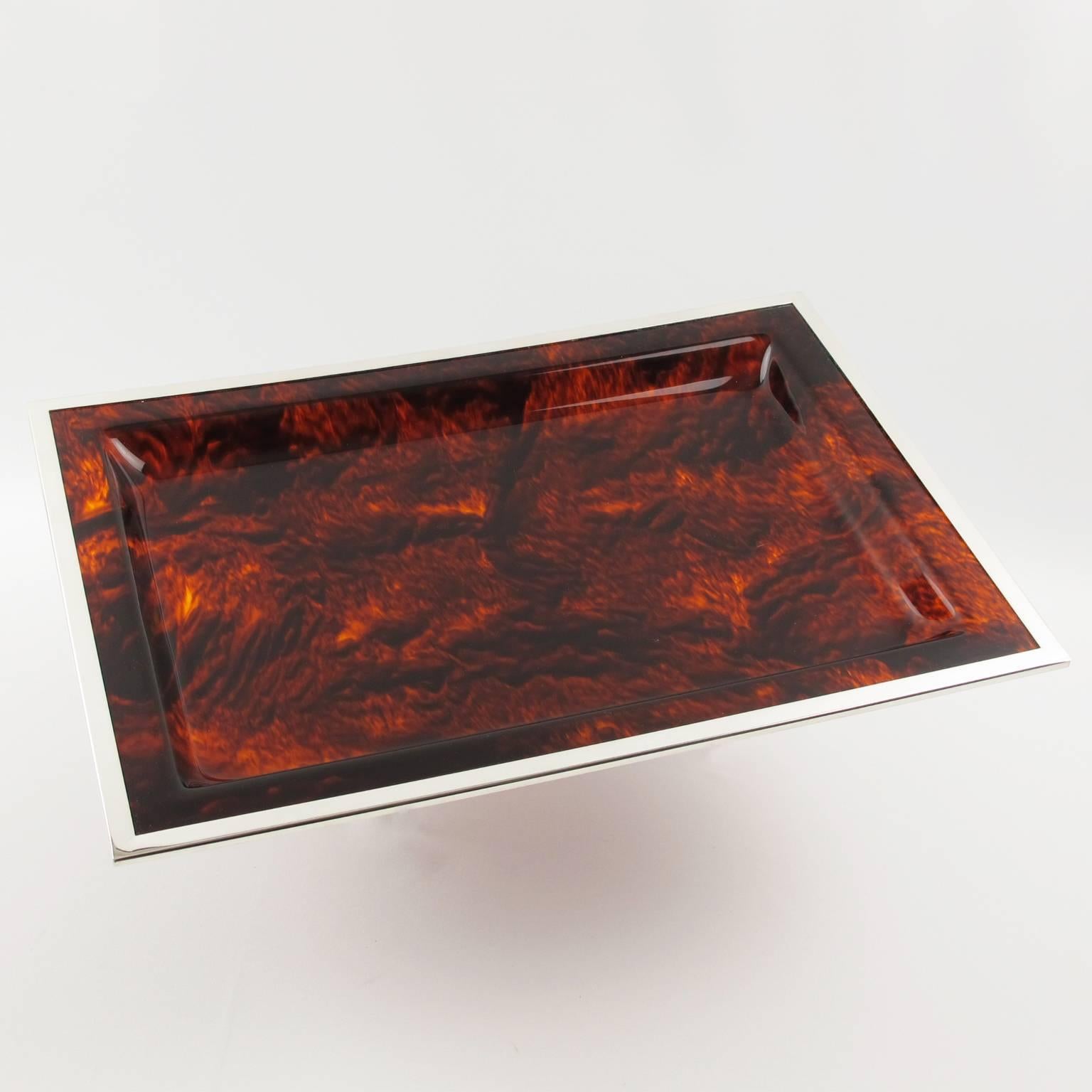 Stunning Mid-Century Modernist serving tray - platter for Christian Dior Home Collection, circa 1970s. Large rectangular shape with Lucite in faux tortoiseshell pattern and color and silver plate border. Excellent vintage condition.

Measurements: