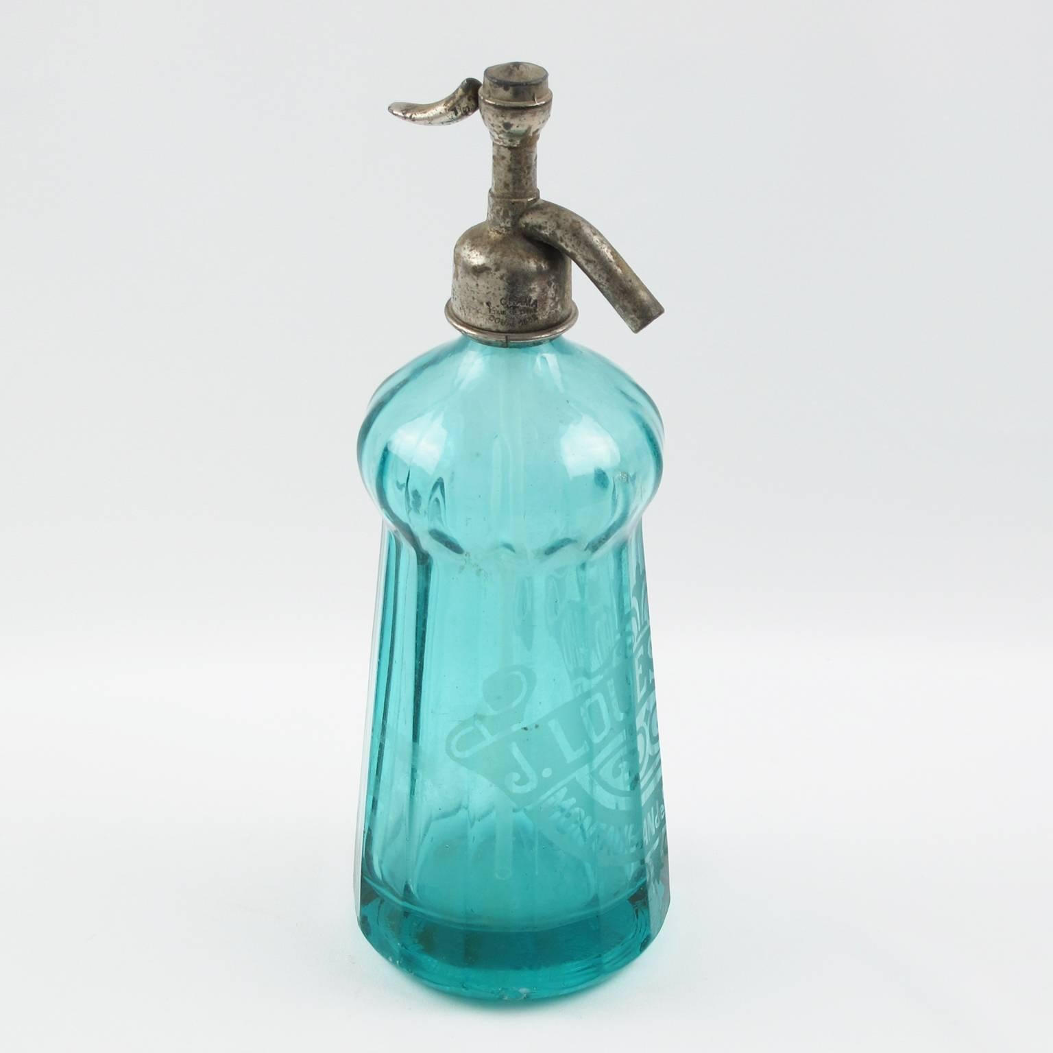 A rare original soda (Seltzer water) turquoise blue glass bottle from France. Featuring the pre-war French cocktail culture, circa 1932 (marked on bottle). Those bottles, mainly used in cafes and restaurants once came in a variety of colors with