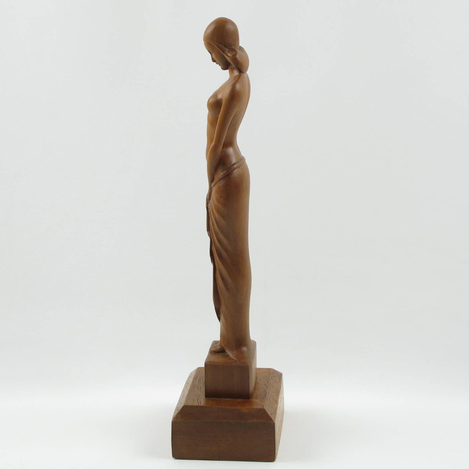Rare elegant vintage wooden sculpture, statuette by French sculptor L. Goussot. Finely carved bare maiden in a typical Art Deco period design. The figurine is made of beechwood with rich golden brown patina, base in mahogany. Signed on base of