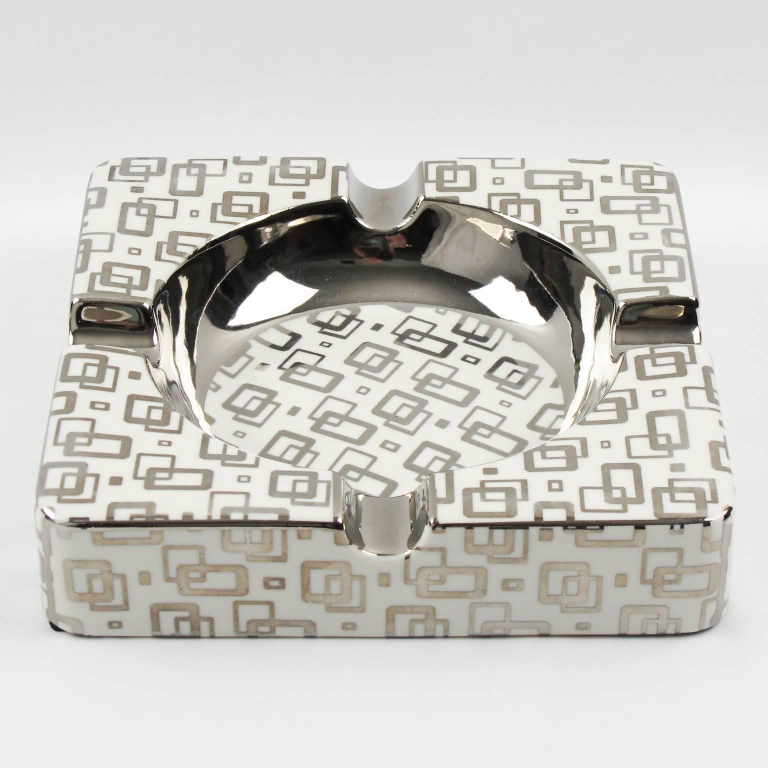 Stunning large white porcelain cigar ashtray by KARE Design, Germany. Silver modernist geometric design on large square shape. Marked underside. Excellent vintage condition. This is a perfect piece for any elegant home with a smoking room or to use