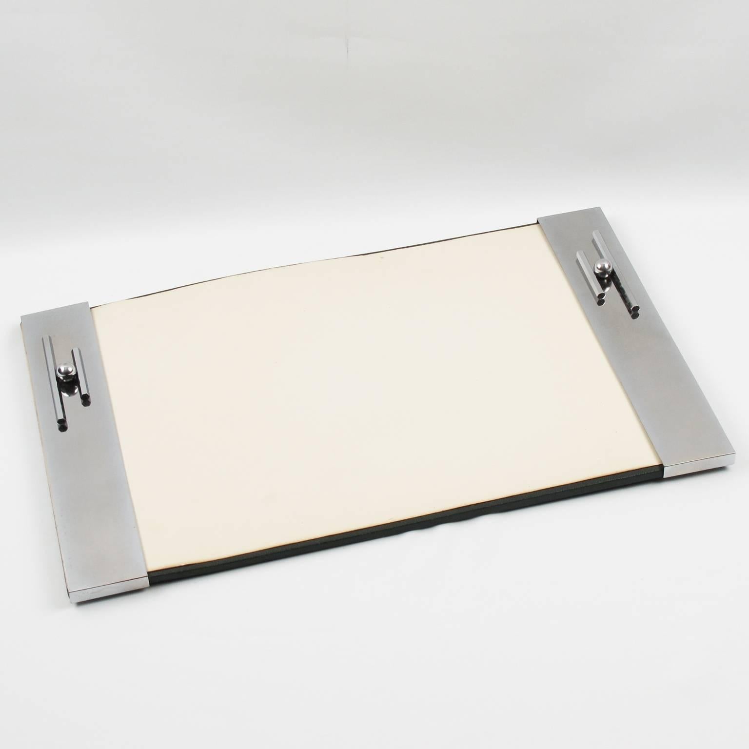 Elegant vintage Art Deco modernist desk blotter pad. Geometric dimensional streamline chromed metal design on both side with original blotter paper sheet, France, circa 1930s.

Measurements: 17.32 in. wide (44 cm) x 11 in. high (28 cm).