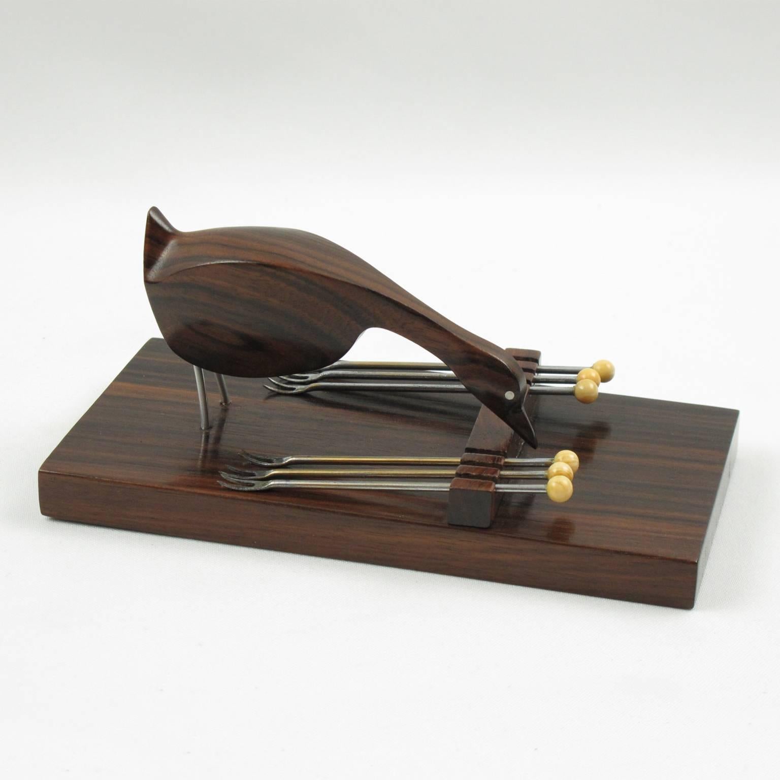Rare vintage barware bar set cocktail picks. Wonderful French Art Deco bar accessory made of Macassar ebony wood and bone. Features a lovely hand-carved goose with chromed metal legs and eyes on a wood base with six metal cocktail forks with bone