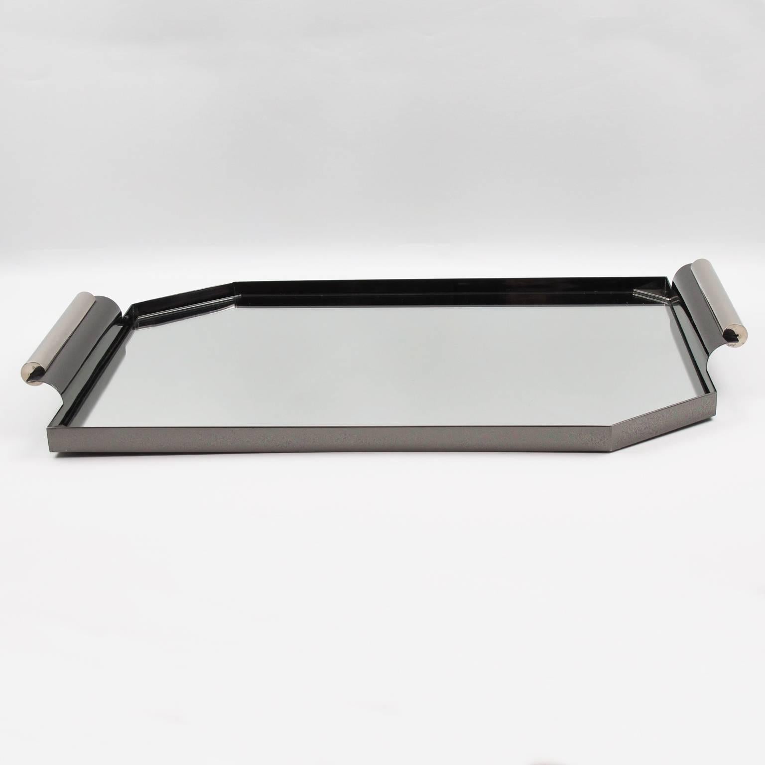 Unusual modernist cocktail serving tray from France, circa 1940s. Machine Age Industrial design with rectangular shape and cut corners. Large asymmetric handles. Rare chromed metal with original silver and black patina. Excellent vintage
