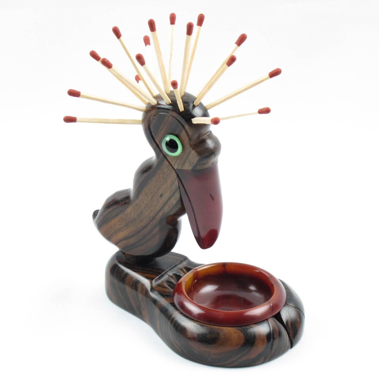Rare iconic English Art Deco Henry Howell & Co Ltd, YZ bird novelty match holder, striker, ashtray, dating from the 1920s-1930s for Alfred Dunhill Ltd. The ultimate in grotesque, a stumpy plump pelican bird with an outrageous Mohican