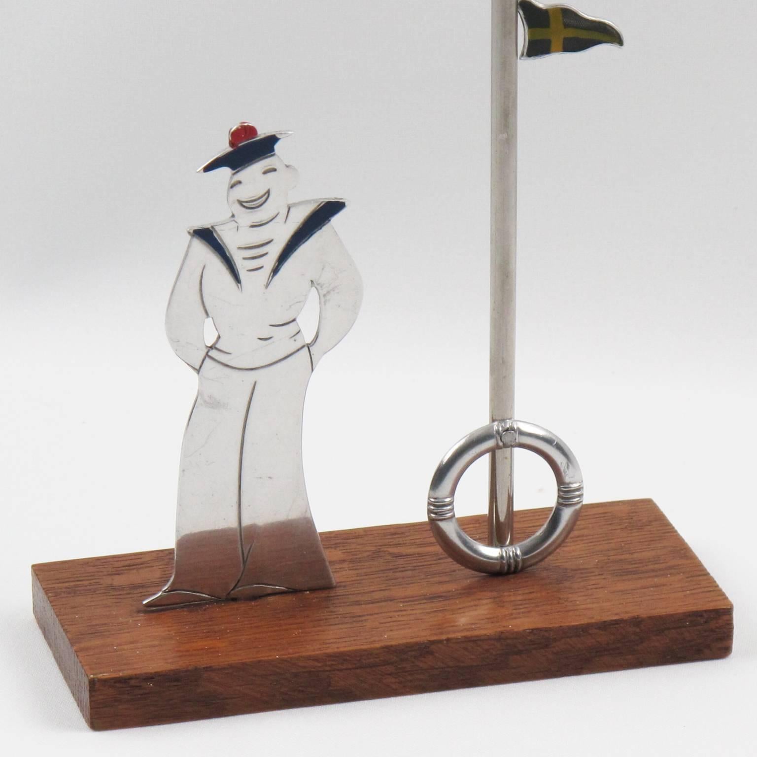 Rare stunning French Art Deco barware accessory glass markers for cocktail and party by Sudre, circa 1930s. Featuring an aluminum silhouette shape of a French Navy sailor with enameling details and a huge pole holder. Pole holder is in aluminum with