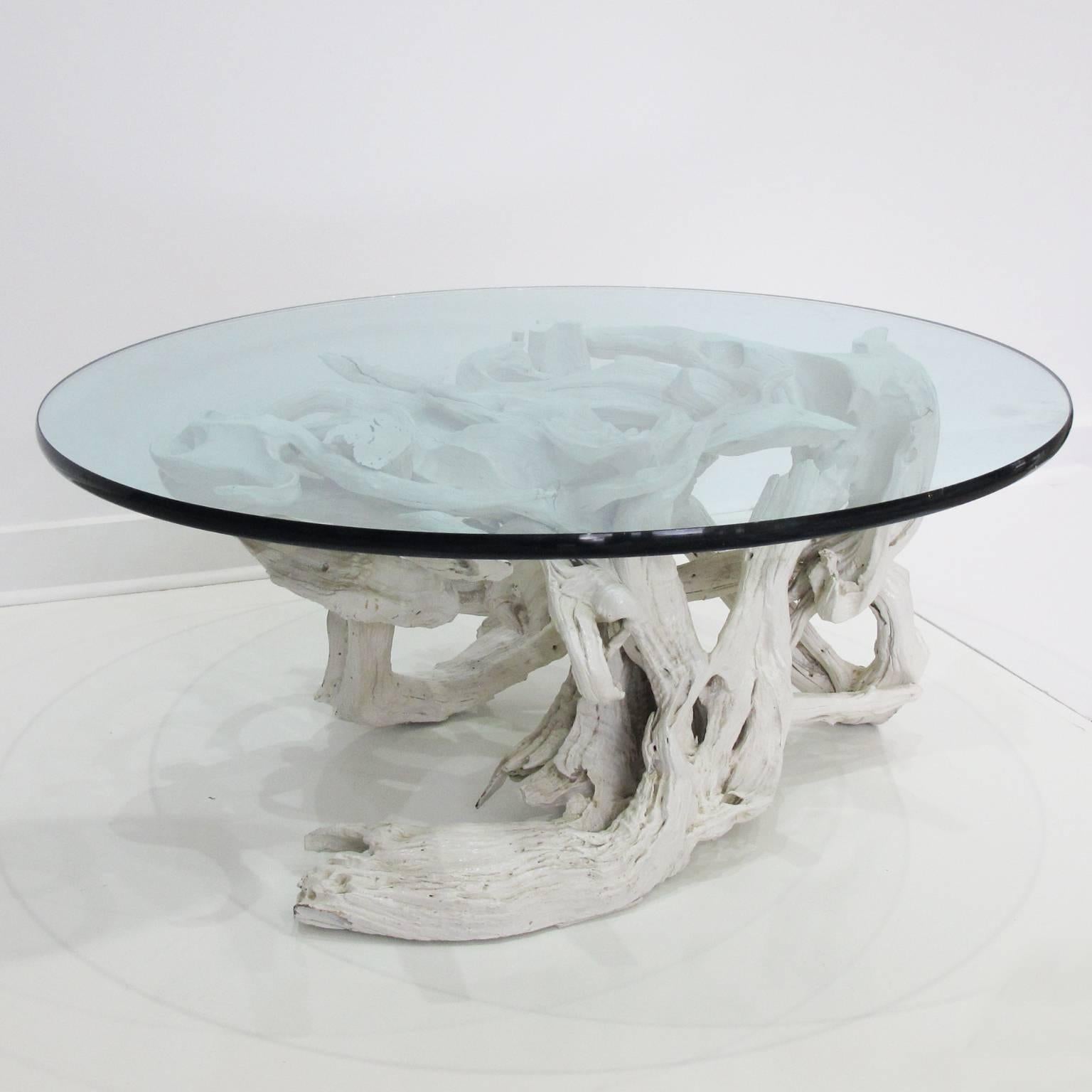 Elegant Mid-Century Modern round coffee table. Sculptural assemblage of creme/white gesso washed driftwood elements with free-form organic shape and modern feel. The table is in beautiful original condition and supports its original round stick