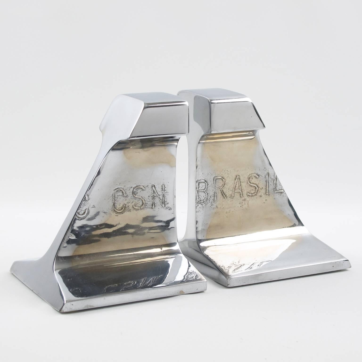Vintage Industrial pair of bookends. Made of railroad rail sections in polished chrome-plated stainless steel. Marked CSN Brasil on front. We believe these bookends were probably corporate gift. Very heavy and perfectly stabile for books hold use.