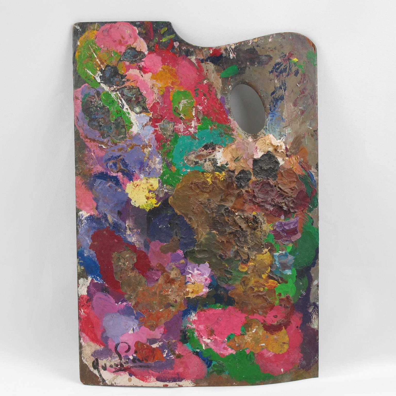 Large painter's palette made of a single wood board with rectangular shape, one side shaped and thumb hole, once belonging to French artist Yvon Prevel (1943-2002). Rare double-sided where years of use create paint build-up with a lovely pattern,