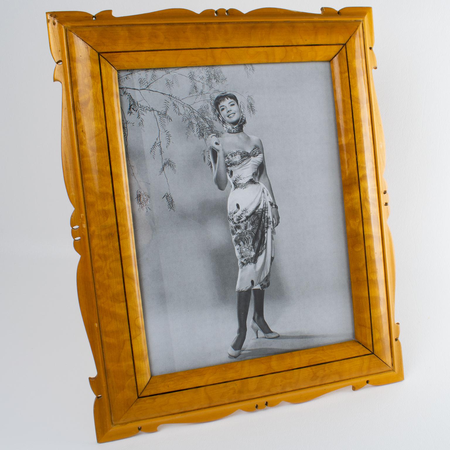 This stunning Italian picture frame boasts a gorgeous, romantic beveled shape with varnished sycamore wood and darker wood inlaid. The back has a wood easel. This frame accommodates both portrait and landscape positioning. There is no visible