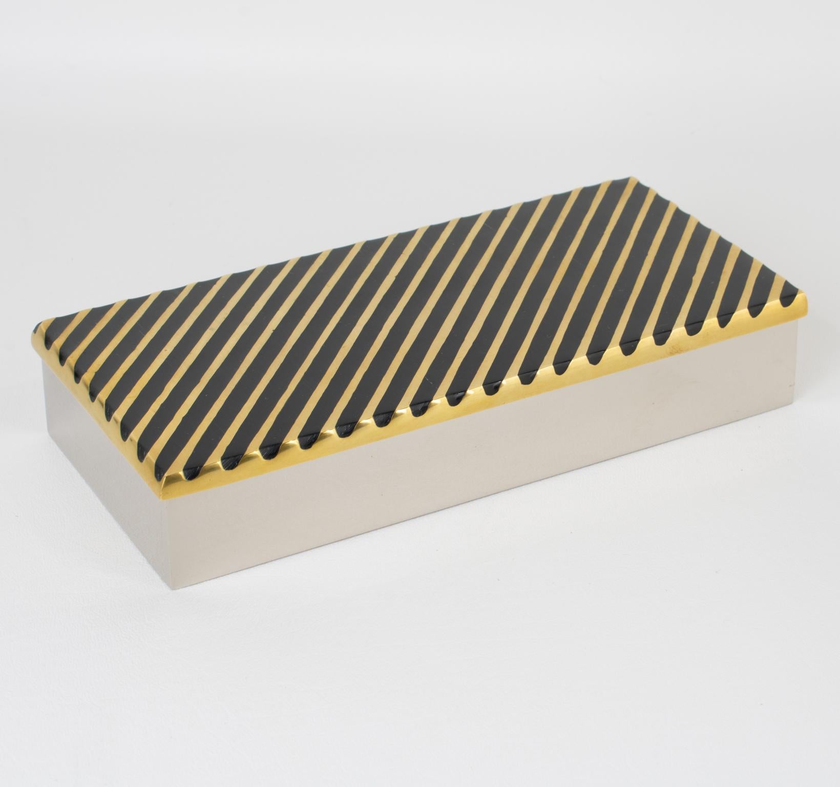 This stunning modernist decorative covered box was designed by Giacomo Sinopoli and crafted by Liwan's Rome in 1970. The piece features a large rectangular shape on a chromed metal base, a substantial gilded bronze lid adorned with a geometric
