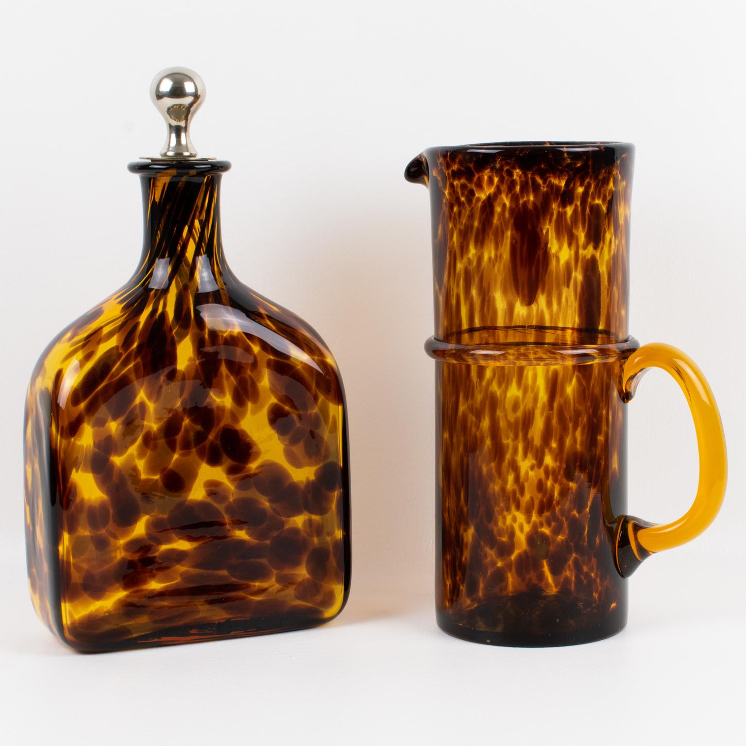 This cocktail ensemble is a stunning barware accessory created by Empoli, Italy, for the Christian Dior Interior Collection circa 1960. A tall Martini or Lemonade pitcher and a geometric decanter with a stopper make up this entertaining pack for the