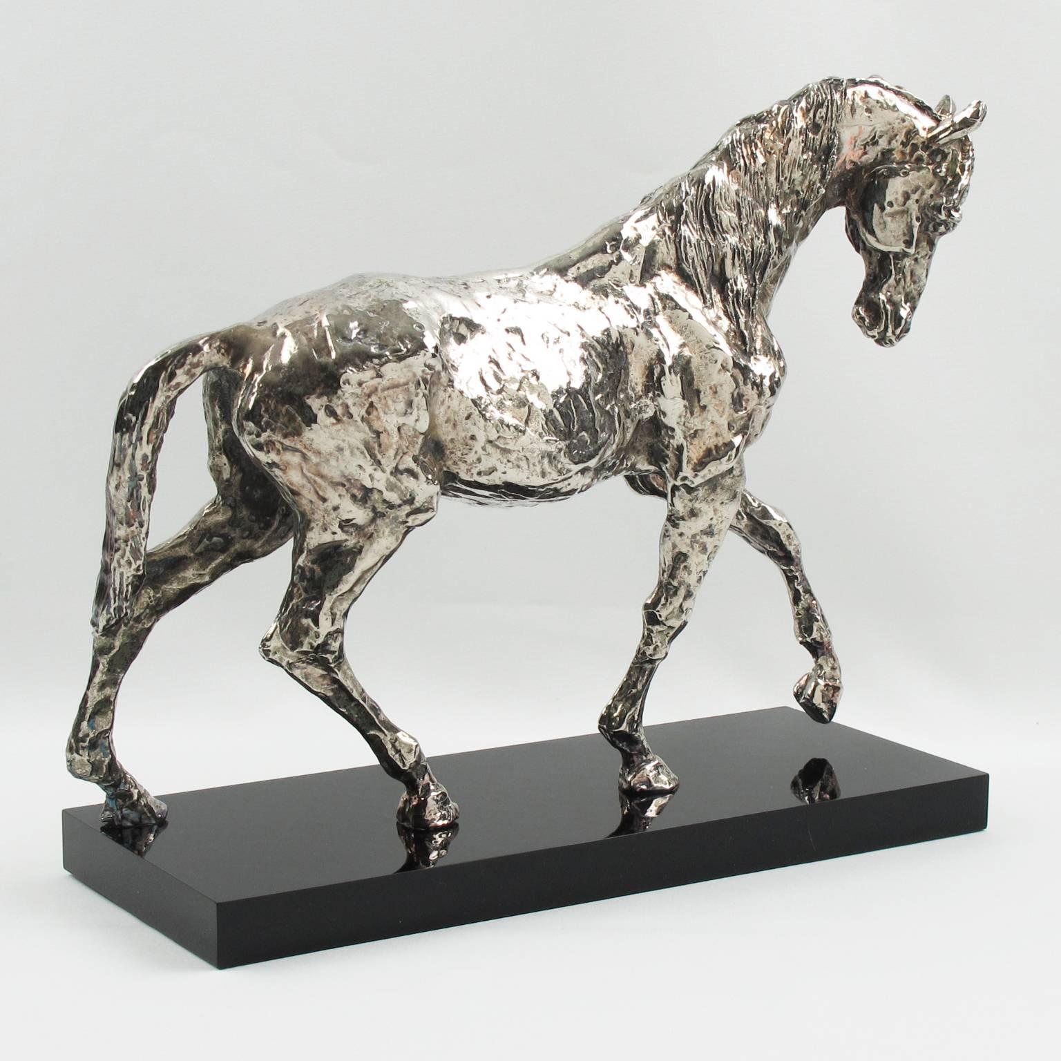 Rare silvered metal horse sculpture mounted on a black Lucite, acrylic thick plinth. Heavy quality with finely detailed carving and hand-made feel finish. Europe, circa mid 20th century.

Measurements: 11.82 in. wide (30 cm) x 4.75 in. deep (12