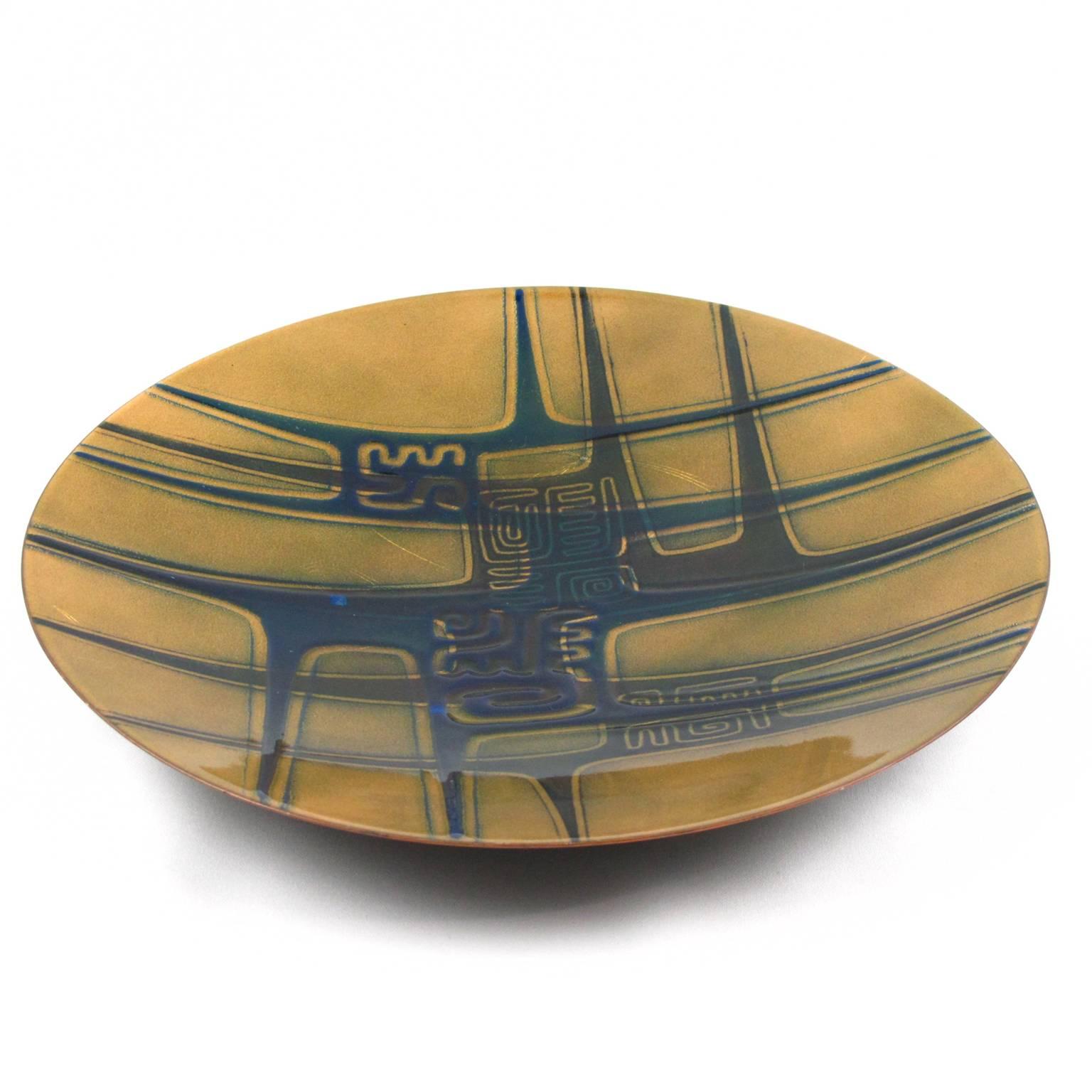 Stunning Mid-Century Modernist handcrafted and fired enamel on copper plate by Canadian Quebec artist, Jules Perrier, circa 1960s. Abstract design with biomorphic kind of shape in contrasted colors of green, blue and black on yellow/gold background.