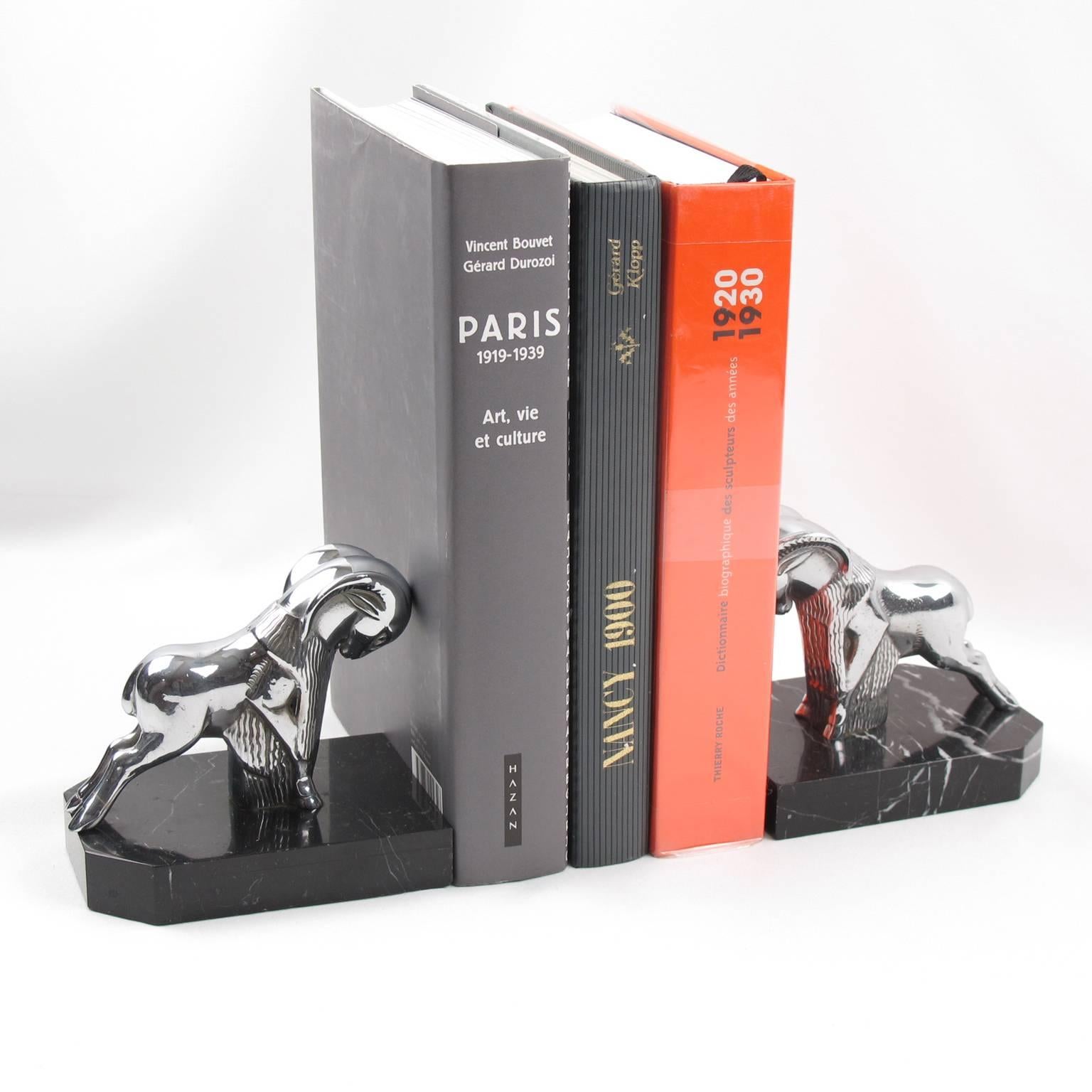 Stunning pair of French Art Deco polished chrome bookends, featuring cute rams on black marble base. Awesome modernist detailed shape. Heavy and definitively usable as real bookends. No visible marking.
Measurements: 4.75 in. wide (12 cm) x 3.57 in.