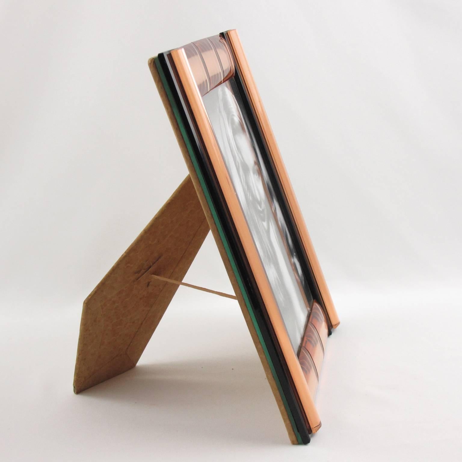 Stunning French 1940s mirrored picture photo frame. Deep geometric beveling and domed sides in lovely copper or peach tone compliment with black color. Frame can be placed either in portrait or in landscape position. Back and easel in decorative