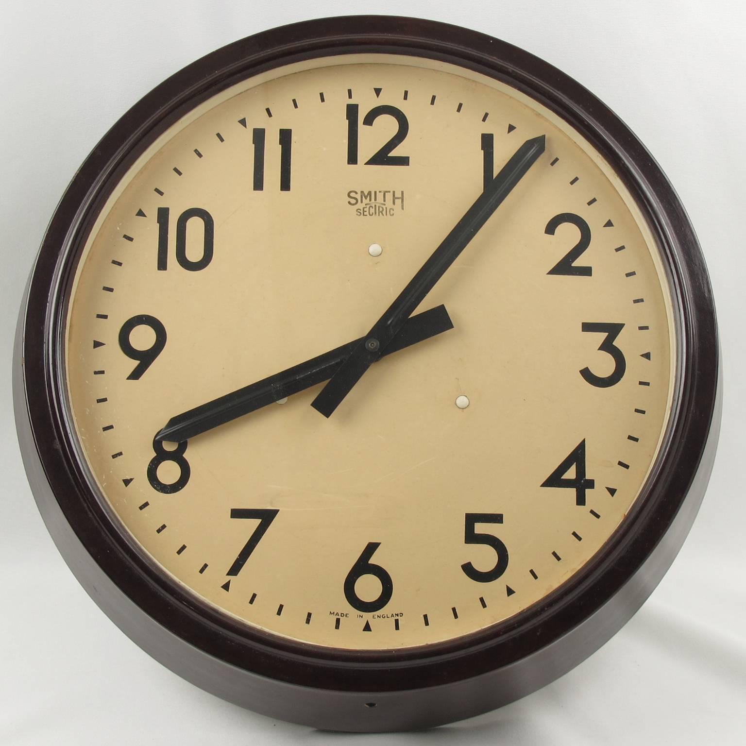 Huge industrial Art Deco wall clock by Smith, England. Brown marble Bakelite frame. Clock face protected with glass. This very nice clock is in perfect working condition. Formerly an electric clock, it is now fitted with a replacement modern quartz