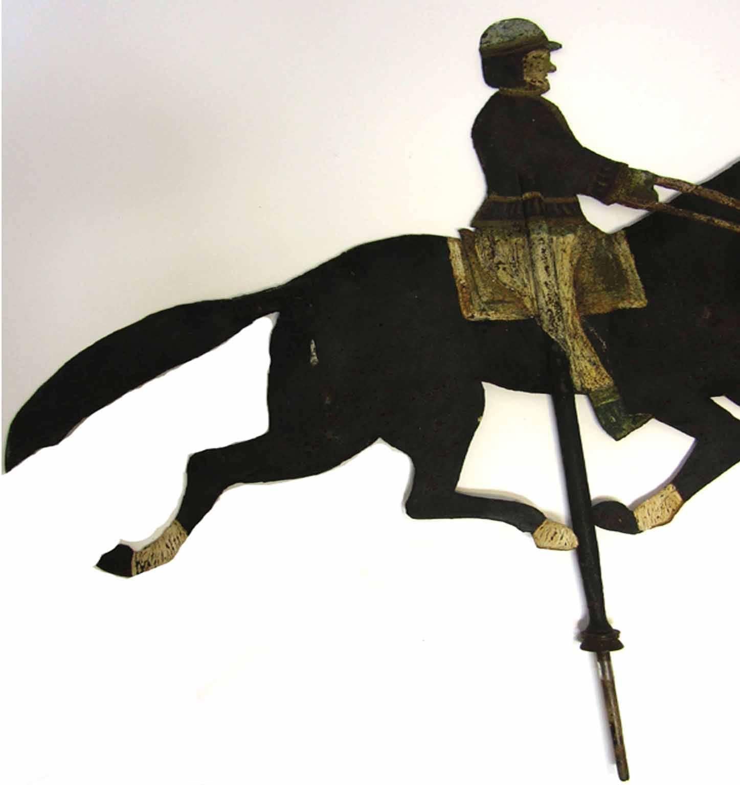 Weather vane {formerly from the carriage house on the Penn seltzer farm, Lebanon county, Pennsylvania}; depicting a figure of a rider wearing a billed cap mounted on a striding horse, with original paint colors. Circa 1825. 