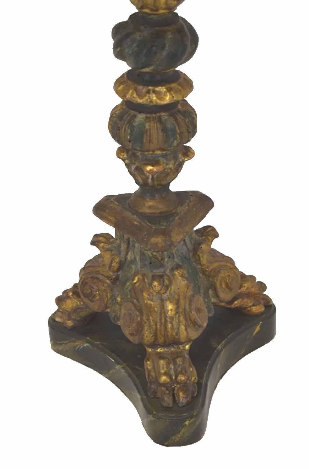 Antique Italian Baroque hand-carved gold leaf green and faux marble pricket candlestick custom wired as a table lamp. A gadrooned rim over a tapering fluted and ringed standard resting upon a lion-paw footed tripartite base, custom parchment shade,
