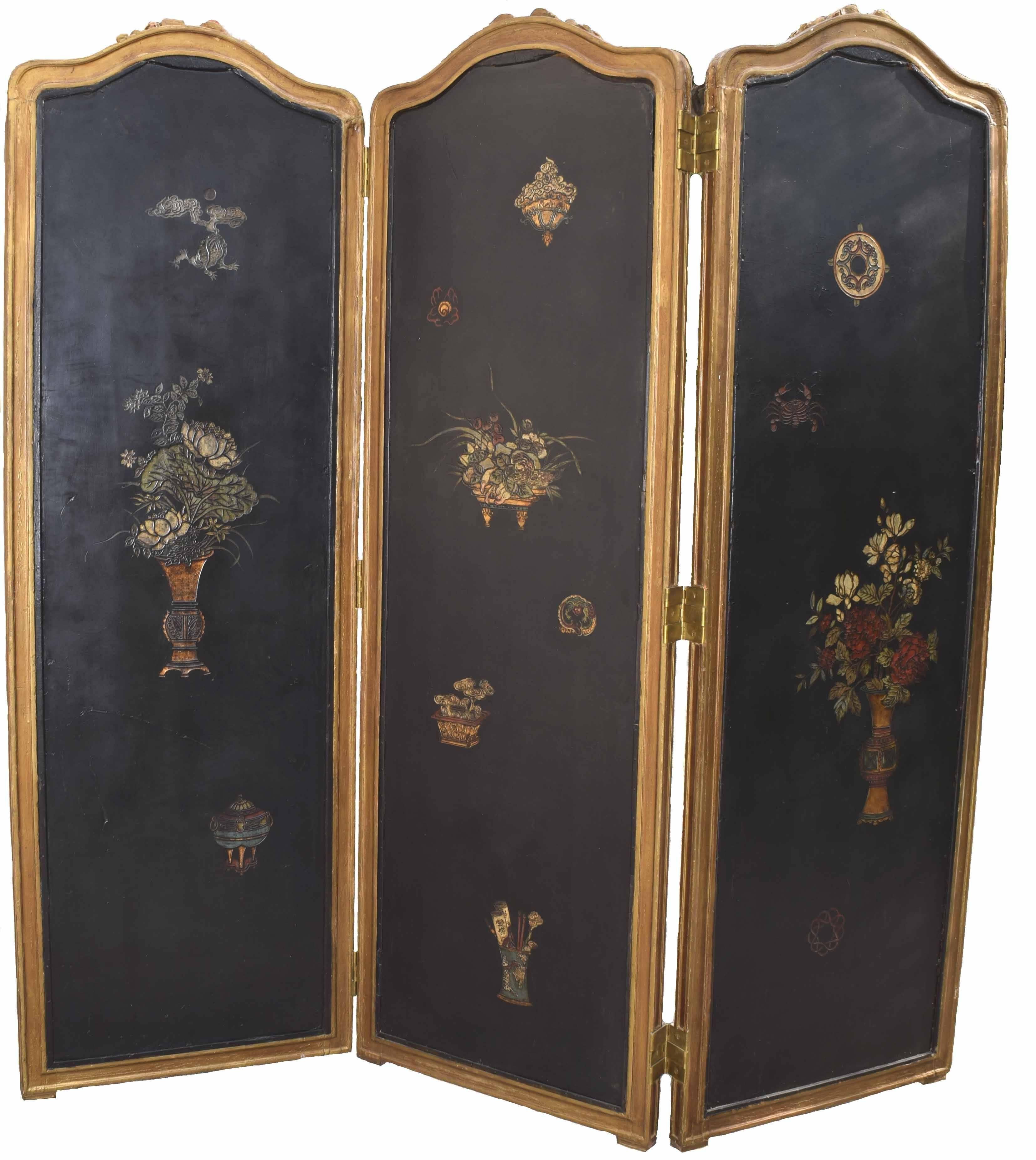 French antique gold-leaf three-panel folding screen inset with antique Chinese coromandel scenic panels; each painted with rockwork. Flowering these and exotic birds in muted tones against a back ground, circa 1870.