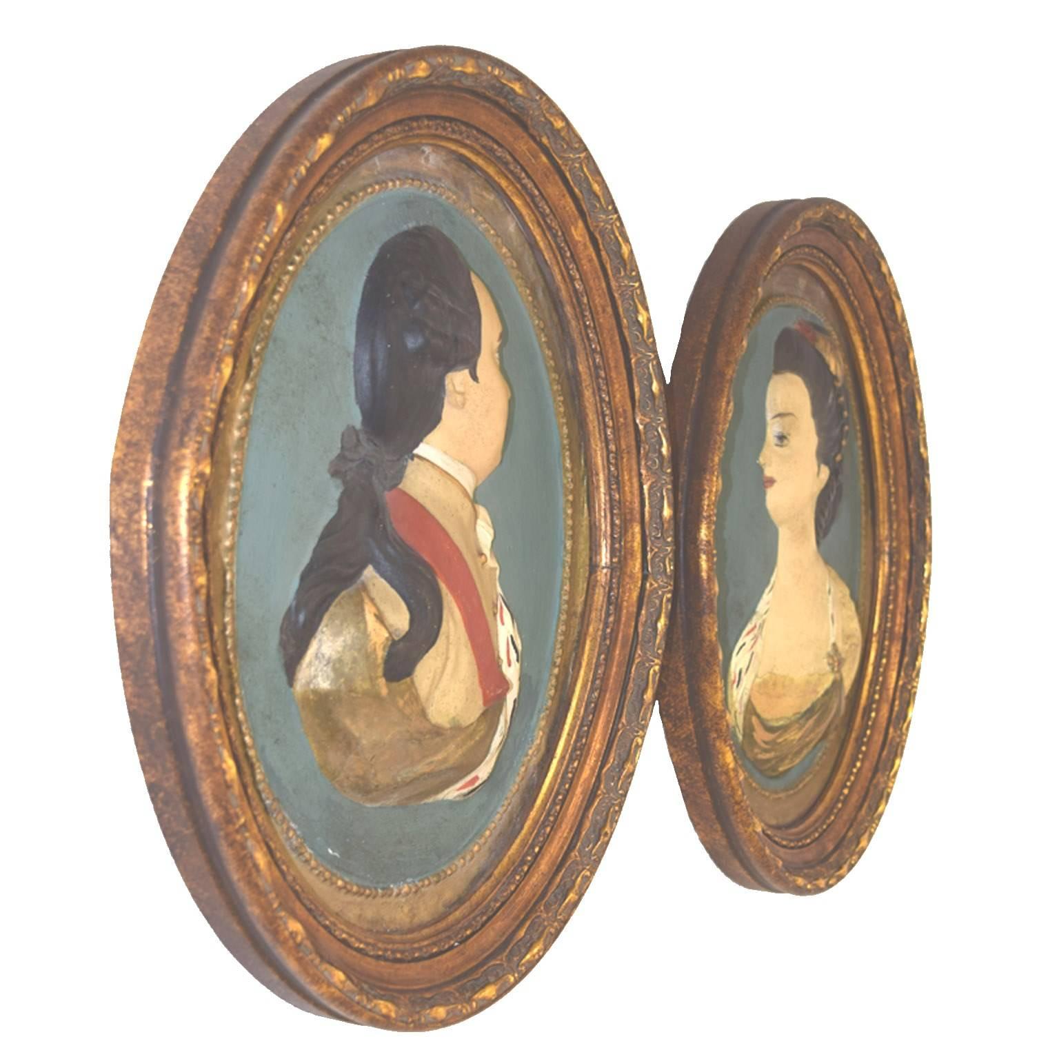 American late 18th century plastered and polychrome papier mâché oval plaques of English monarchs, George III and Queen Charlotte attributed to Henry Christian Geyer, of Boston, Massachusetts, contained in carved gold-leaf oval frames, circa 1765.