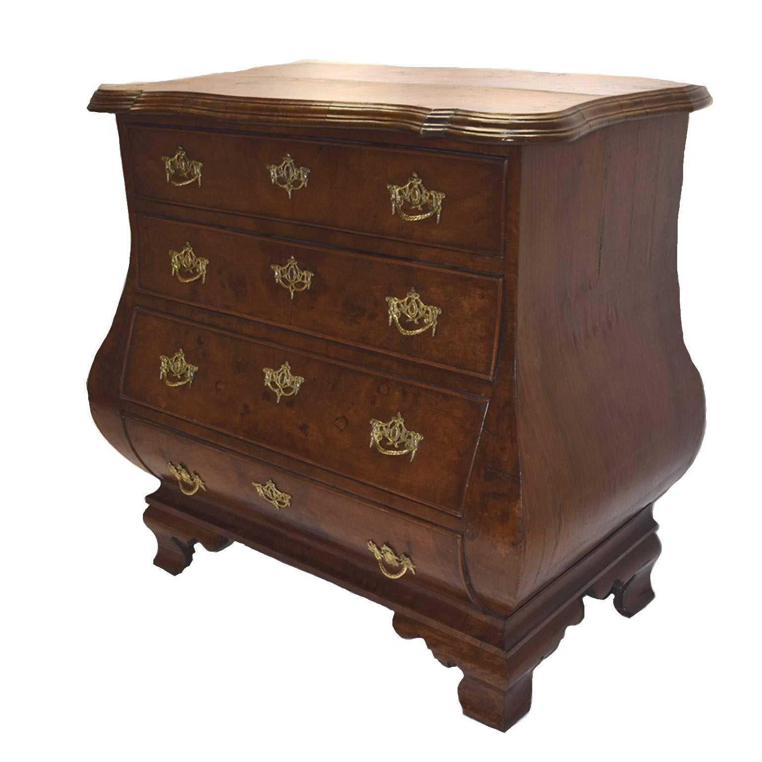 Antique Anglo/Dutch 18th century burl walnut diminutive bombe chest, with a rectangular top having a wave-carved edge, over four gradated drawers of bombe outline and fitted with original cast brasses sides also of bombe form and raised on shaped