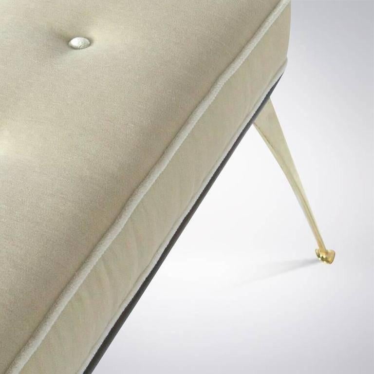 Sculpted solid brass legs, upholstered in ivory mohair over a solid walnut plataform.

