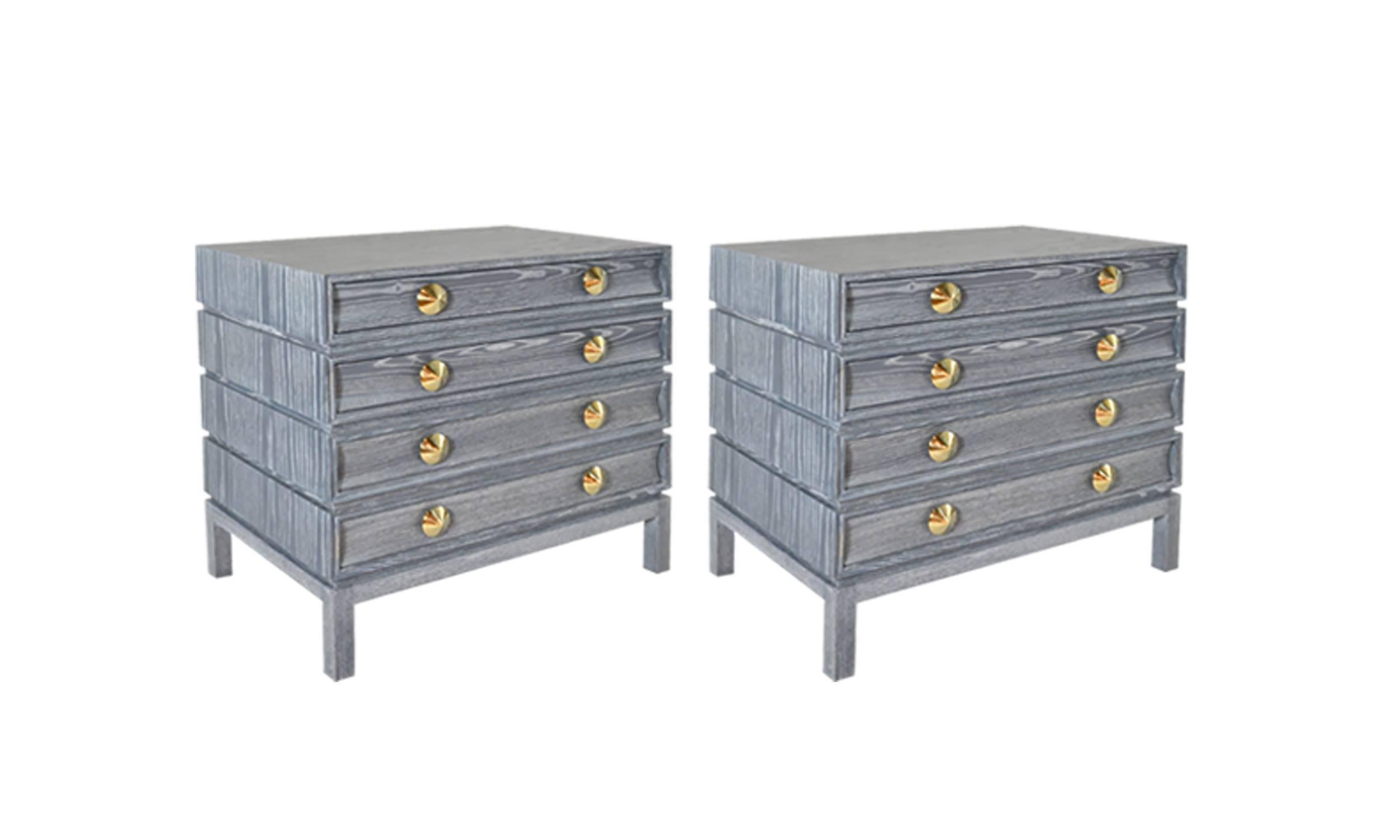 Paul Frankl inspired pair of bedside tables designed and manufactured by Stamford Modern Originals. 

Handcrafted from solid oak in a limed or cerused finish. Set of four drawers provide ample storage space. Solid dome-shaped brass pulls add the