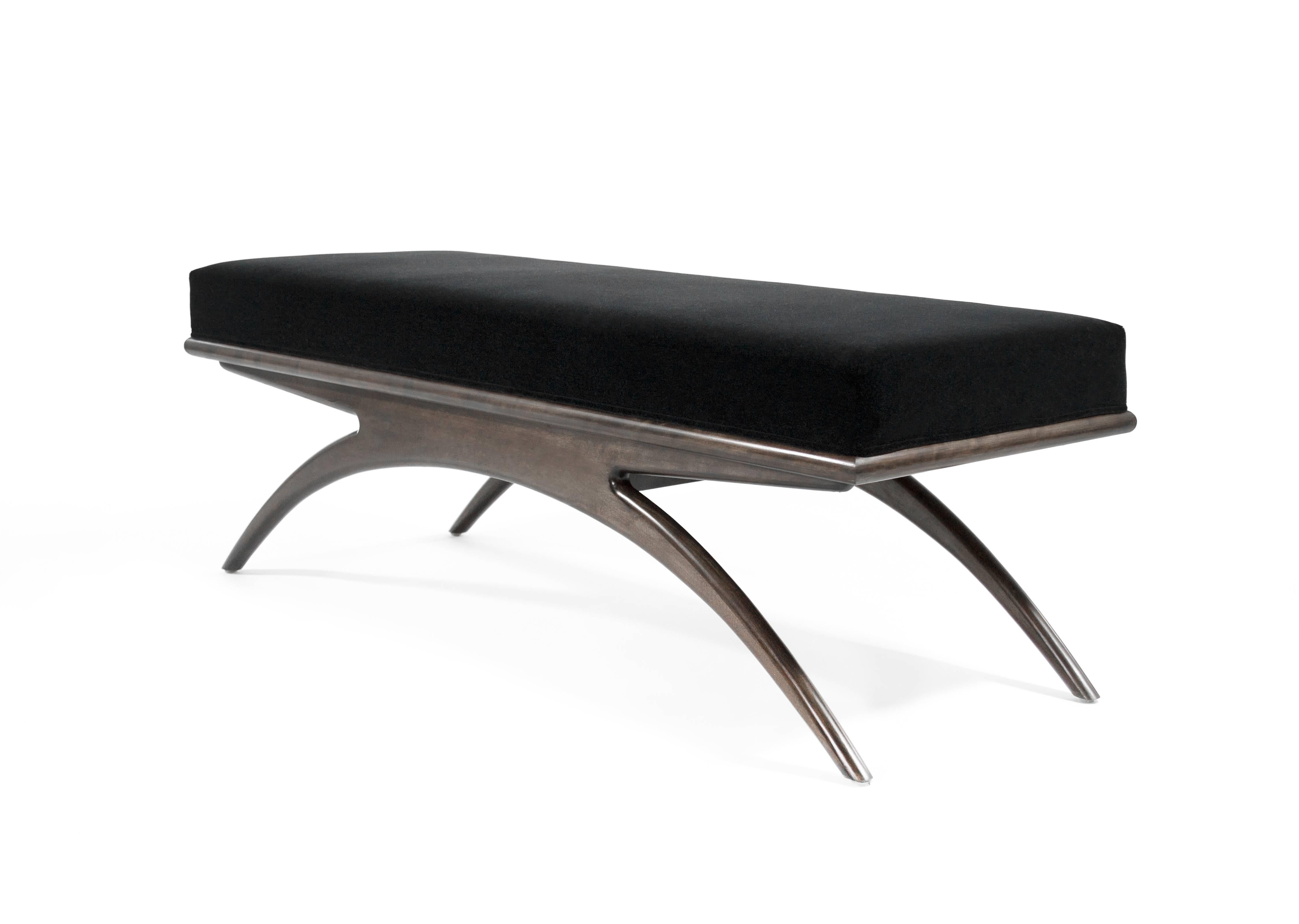 Artistically handcrafted from solid walnut featuring tapered arched legs underneath an upholstered top. The design is largely inspired by iconic Italian furniture designer Gio Ponti. We are proud to mimic his tradition of making pieces that are