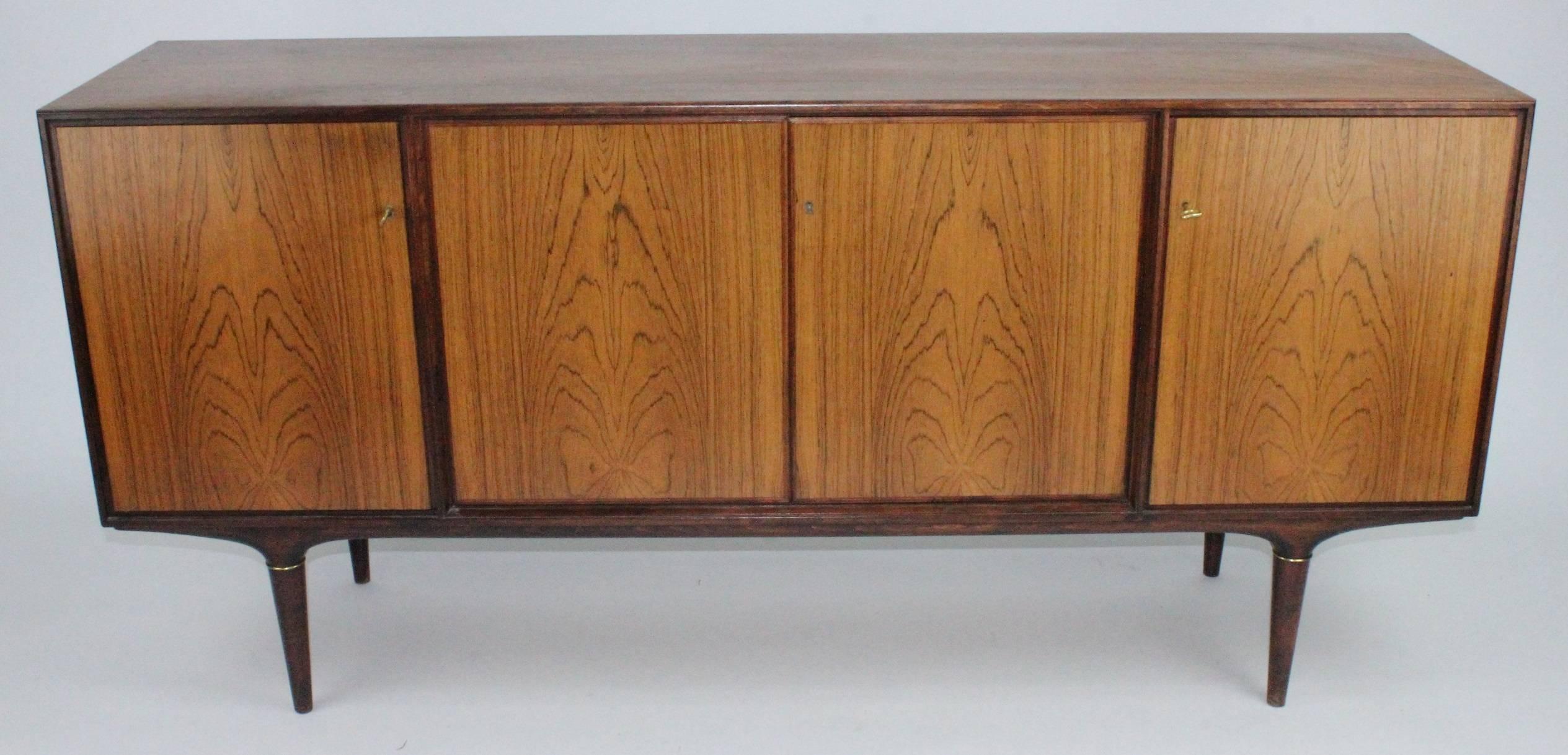 Very nice sideboard model Cortina in rosewood and brass designed by Svante Skogh. Produced in the 1960s by Seffle Möbelfabrik in Sweden. Very good condition. With key.