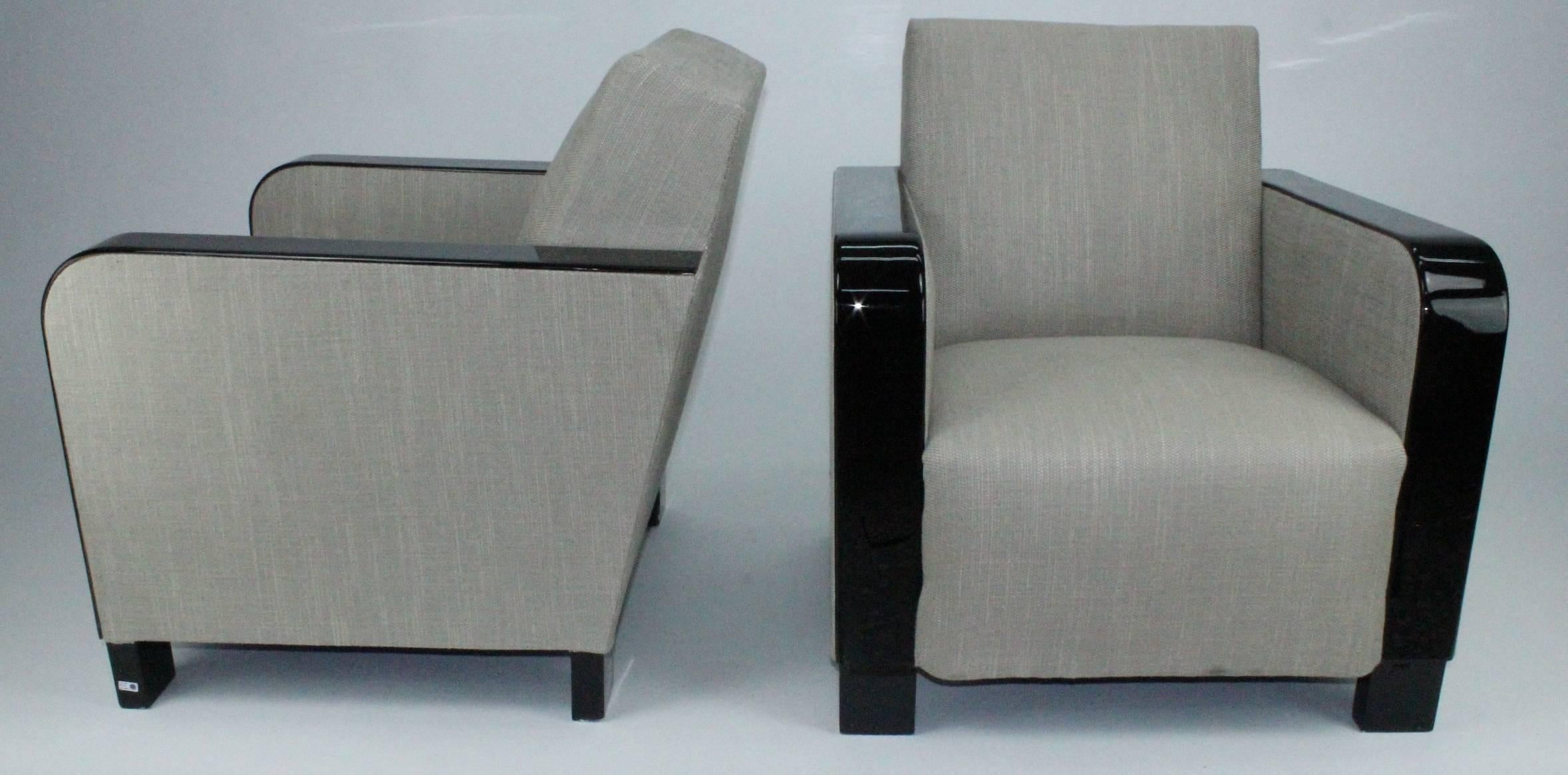A pair of very stylish and comfortable Art Deco club chairs. Swedish Modern, 1930s. Black lacquered and reupholstered. Restored, with some tiny marks and small scratches.