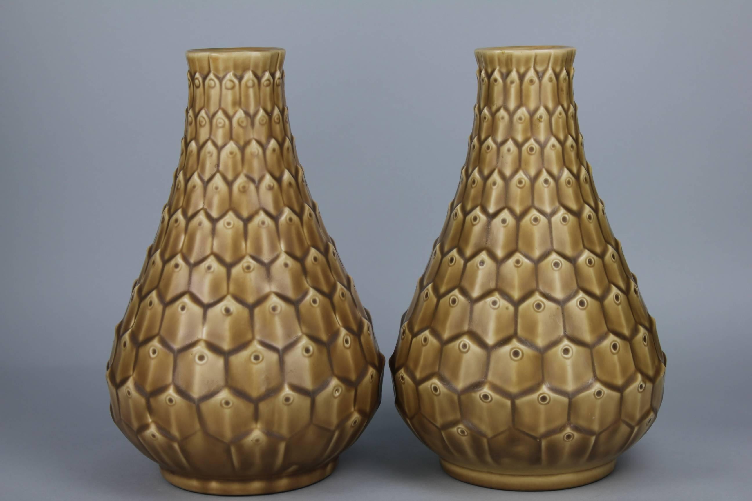 Very rare to see a pair of these lovely vases with peacock pattern. Ewald Dahlskog is the designer and Bo Fajans the maker. These Swedish ceramic vases are from the 1950s. The condition is perfect.