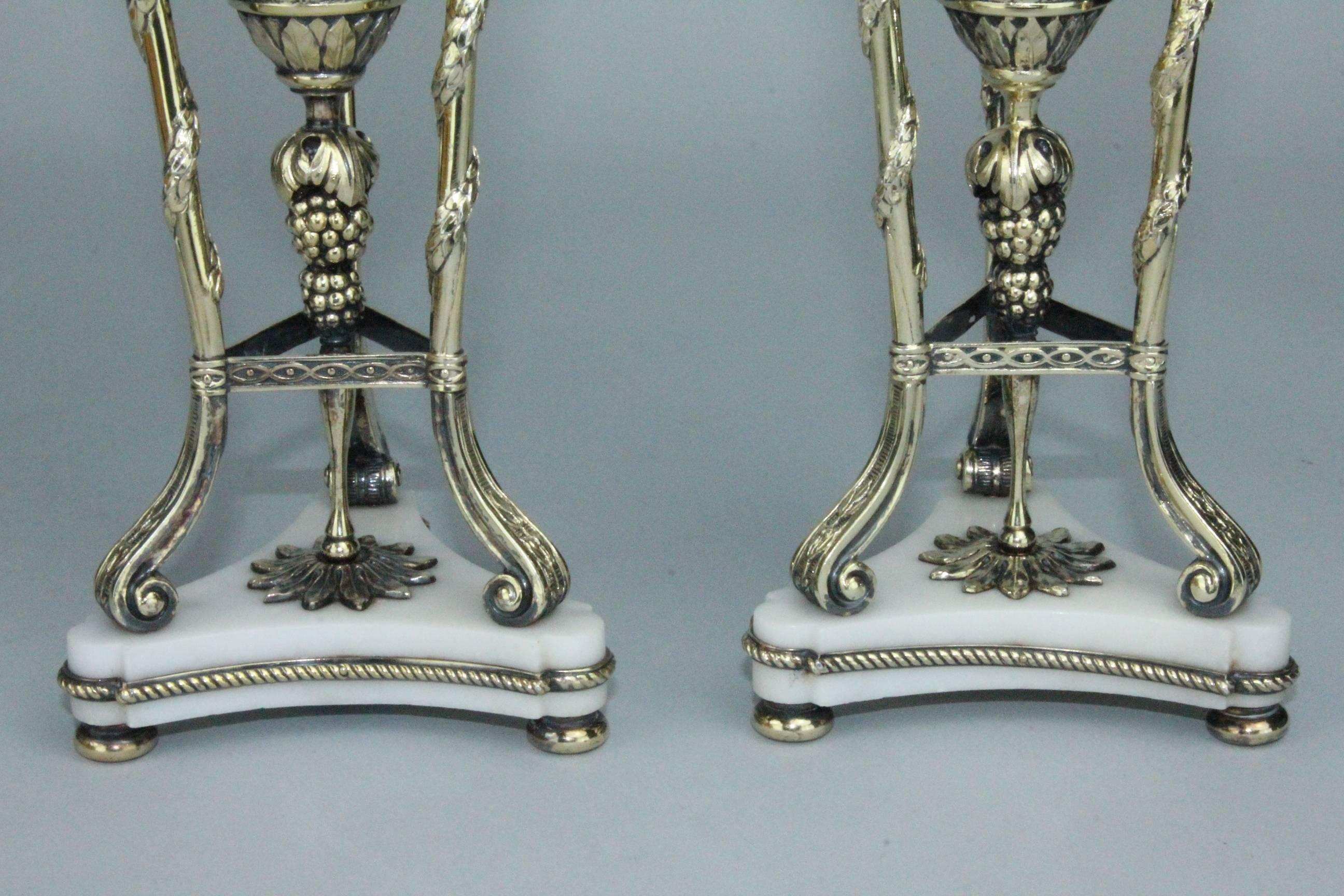 These pair of vases is stunning. The quality, the design, the gilt silver, the Carrara marble and the condition makes them suburb. They were made by the famous silver company C G Hallberg in Stockholm 1912. With flowers or just by themselves they