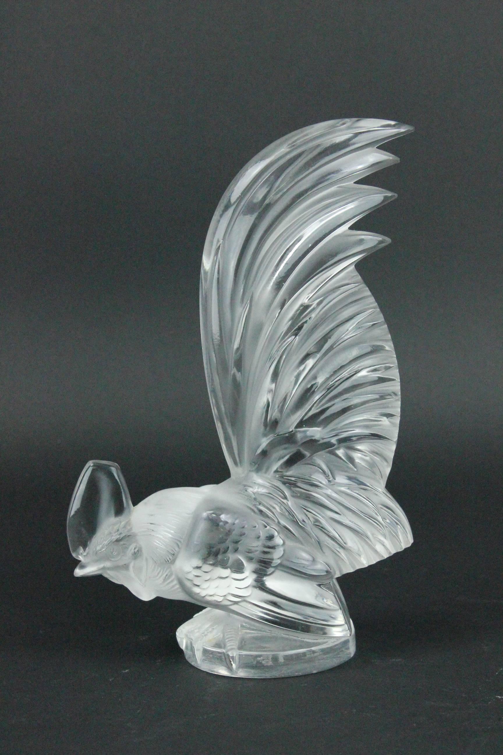 A René Lalique frosted and polished glass Coq Nain car mascot. This is made pre 1945, with acid-stamped 