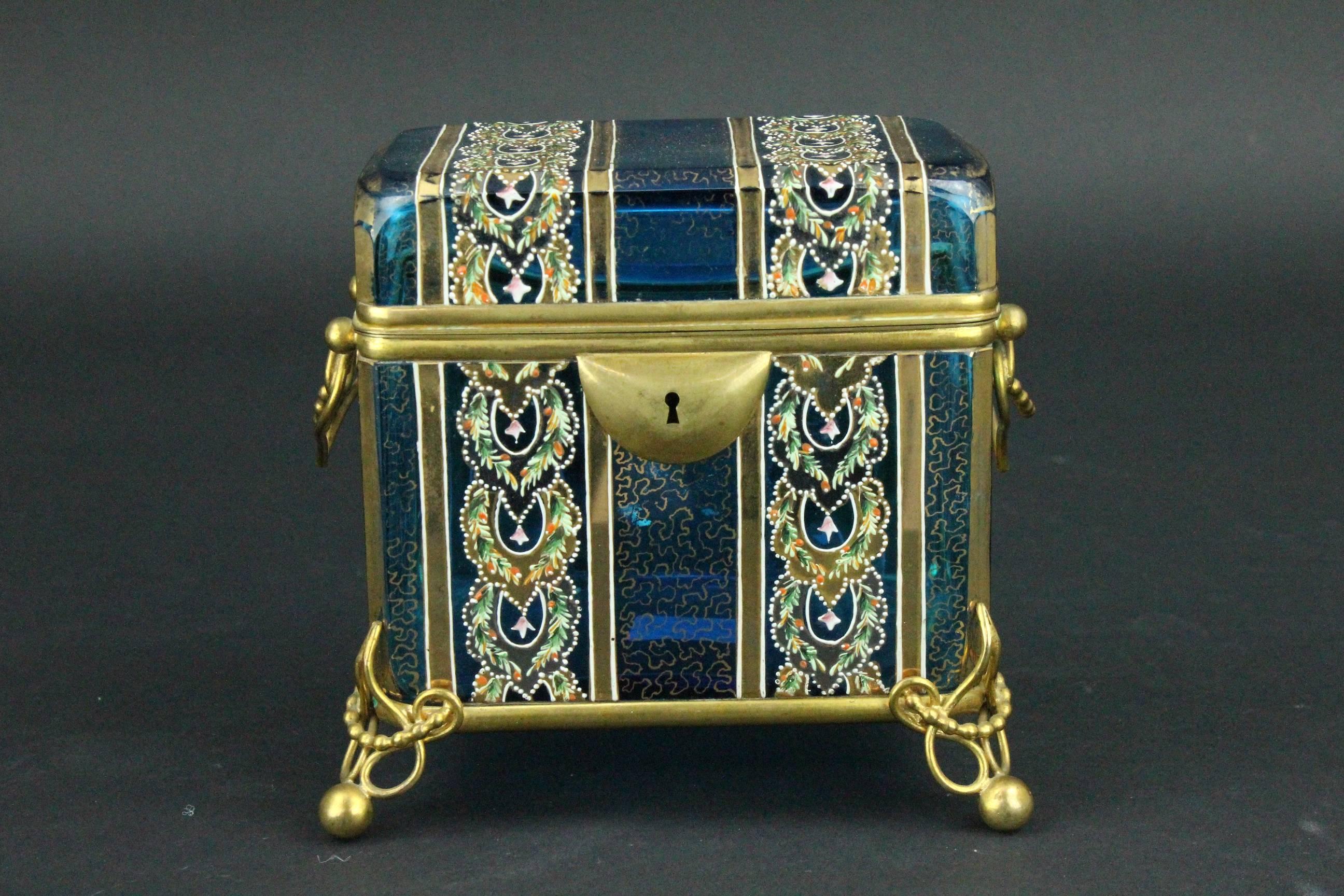 This turquoise blue glass box is very elegant and stylish. Can be used as a jewelry box or will make a great statement on its own. Some rubbing to the gilding otherwise in a very good condition. No key.