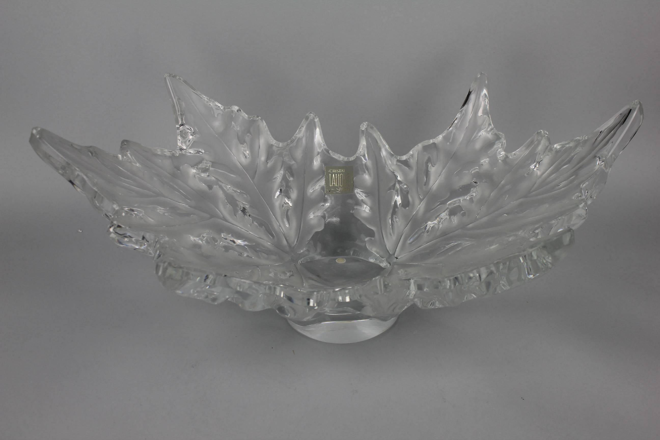 The oval bowl modeled as two sycamore leaves. Lalique no. 11216. Engraved Lalique France.
Made after 1946. Perfect condition.