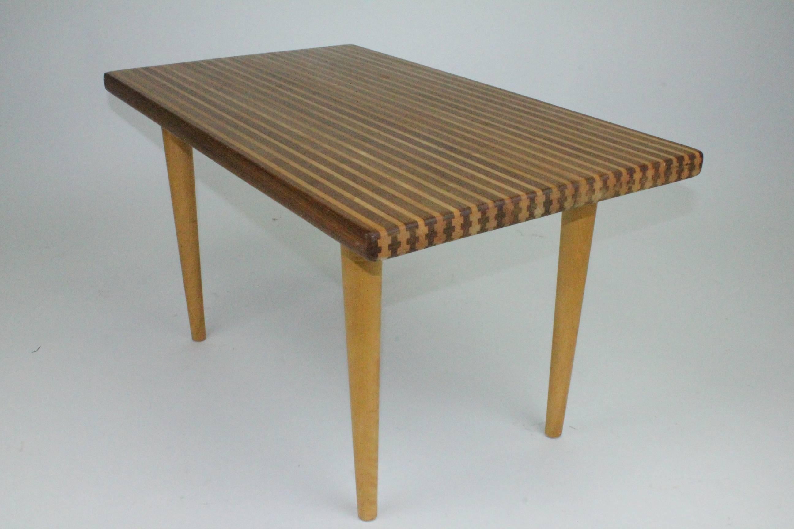 Superb table by Yngvar Sandström, in a striped pattern made from walnut and birch with a solid wood tabletop. Legs in birch. Design 1954 for Nordiska Kompaniet, table no 