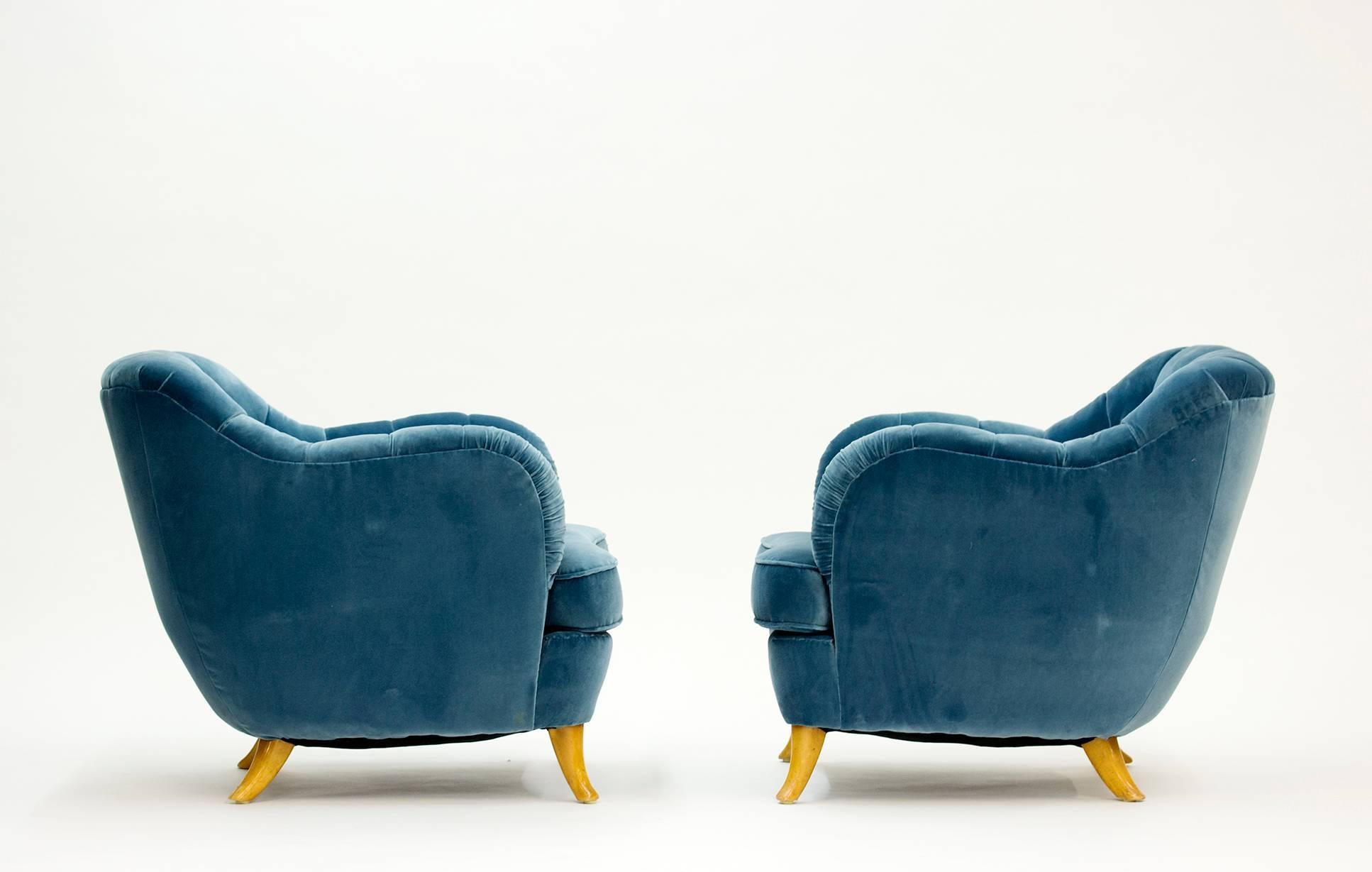 Pair of lounge chairs by Elias Svedberg for NK (Nordiska Kompaniet), upholstered with aquamarine velvet that enhances the refined lines and details of these deluxe chairs.

Elias Svedberg was an architect and designer with a long career at NK,