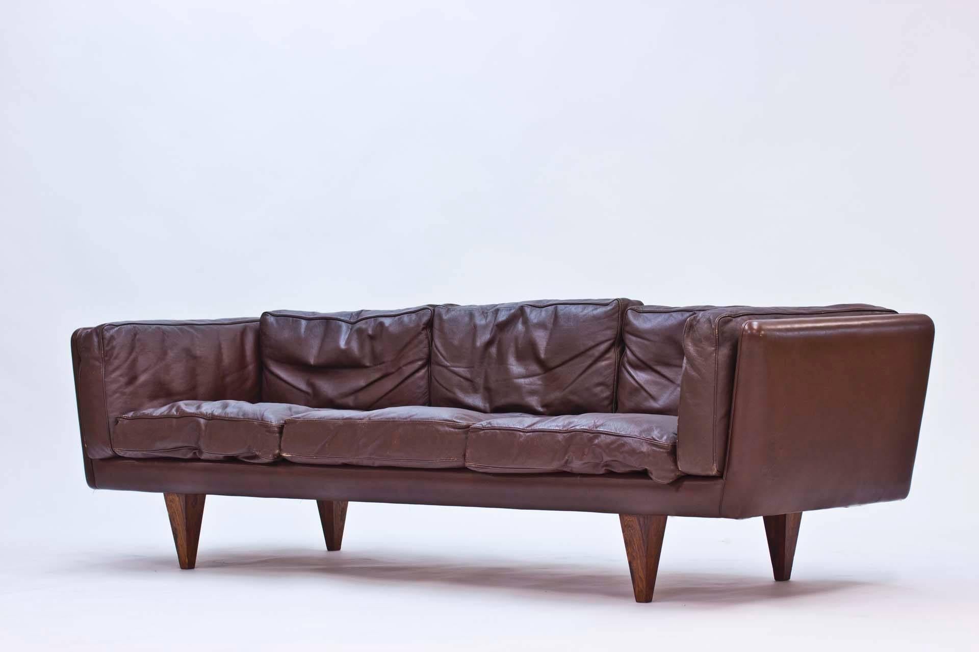 The V11 leather sofa by Illum Wikkelsø is considered a design Classic. The low back and jacaranda frame with conical legs give the sofa an incredibly cool, sleak Silhouette.

Illum Wikkelsø was one of the Danish furniture designers who made Danish